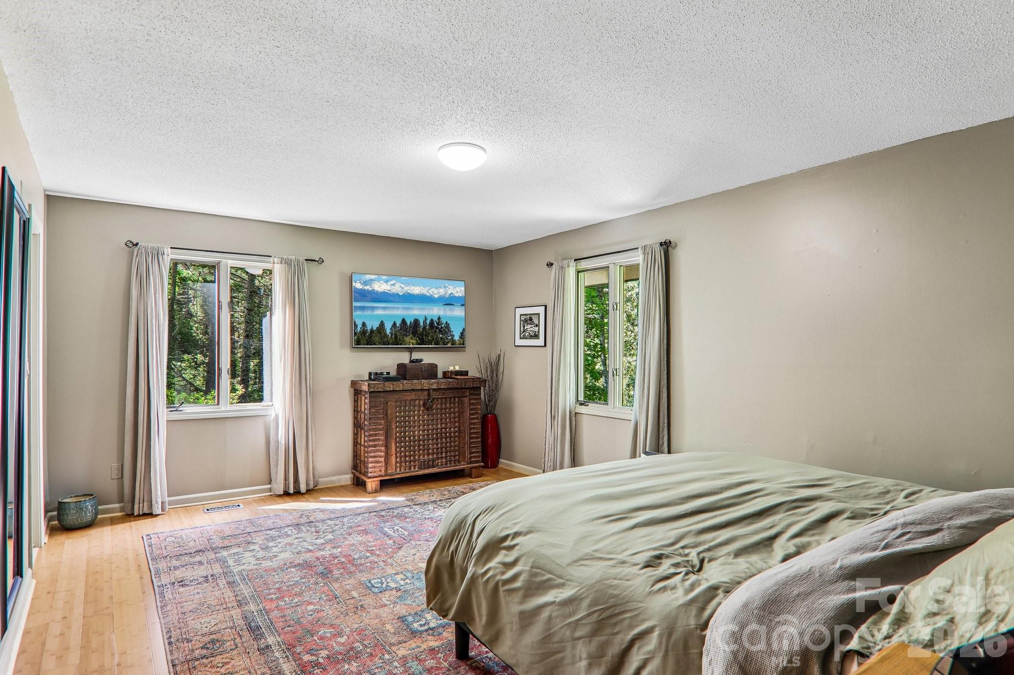 Primary bedroom, walk in closet to the left corner - 2291 Little River Road, Hendersonville