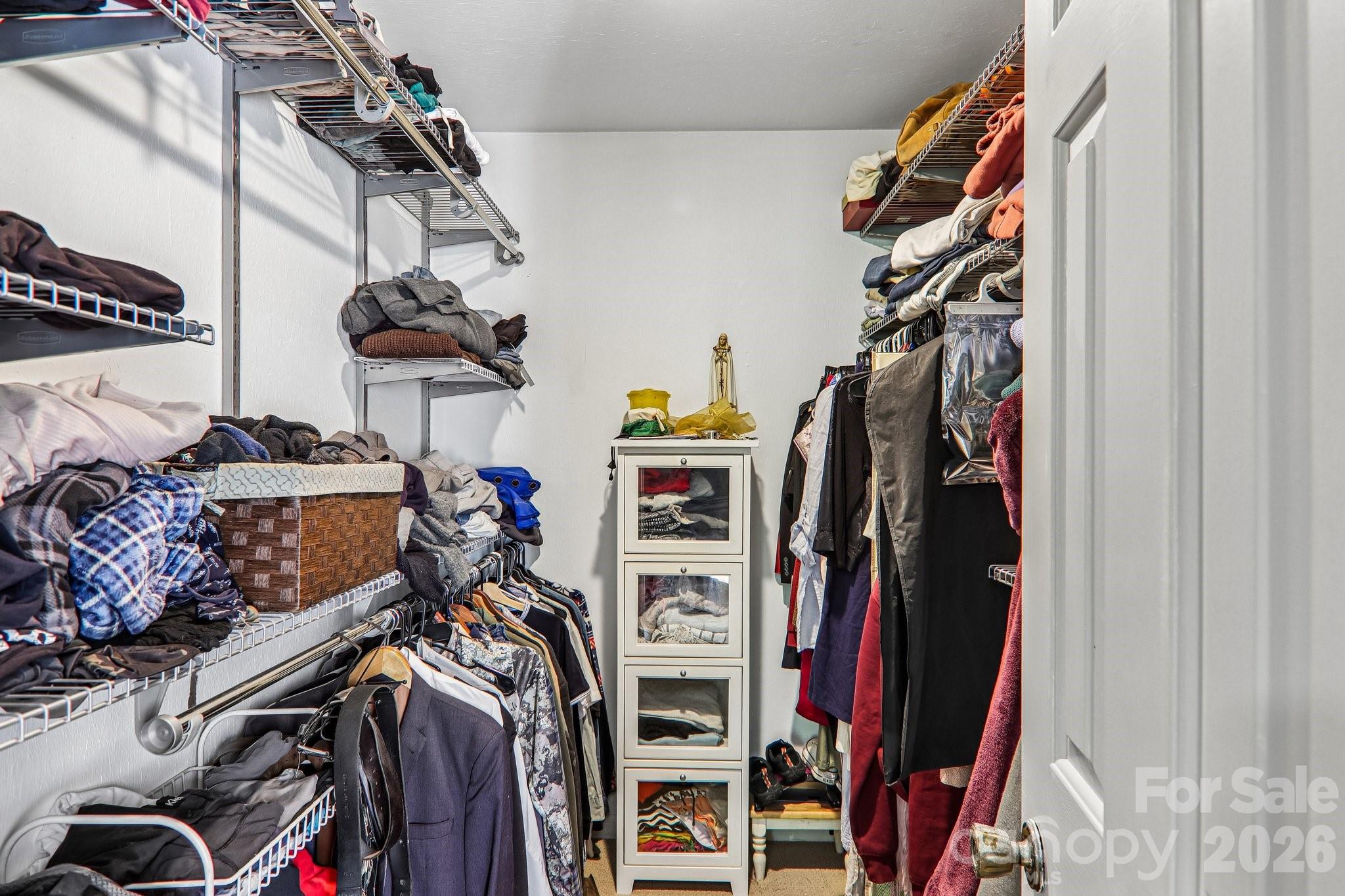 Walk in closet in primary bedroom - 2291 Little River Road, Hendersonville
