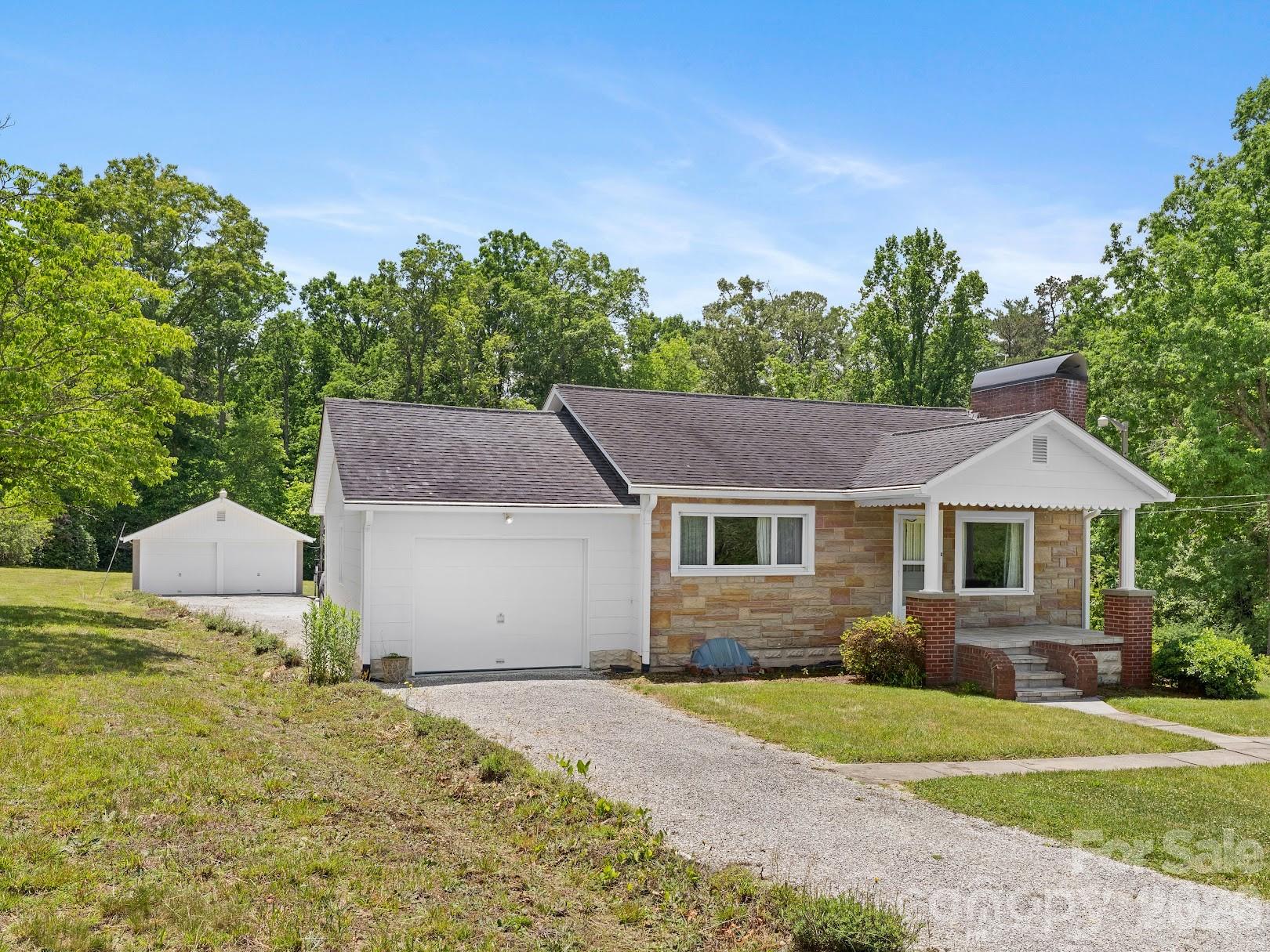 Front View showing detached garage behind - 1230 Dana Road, Hendersonville