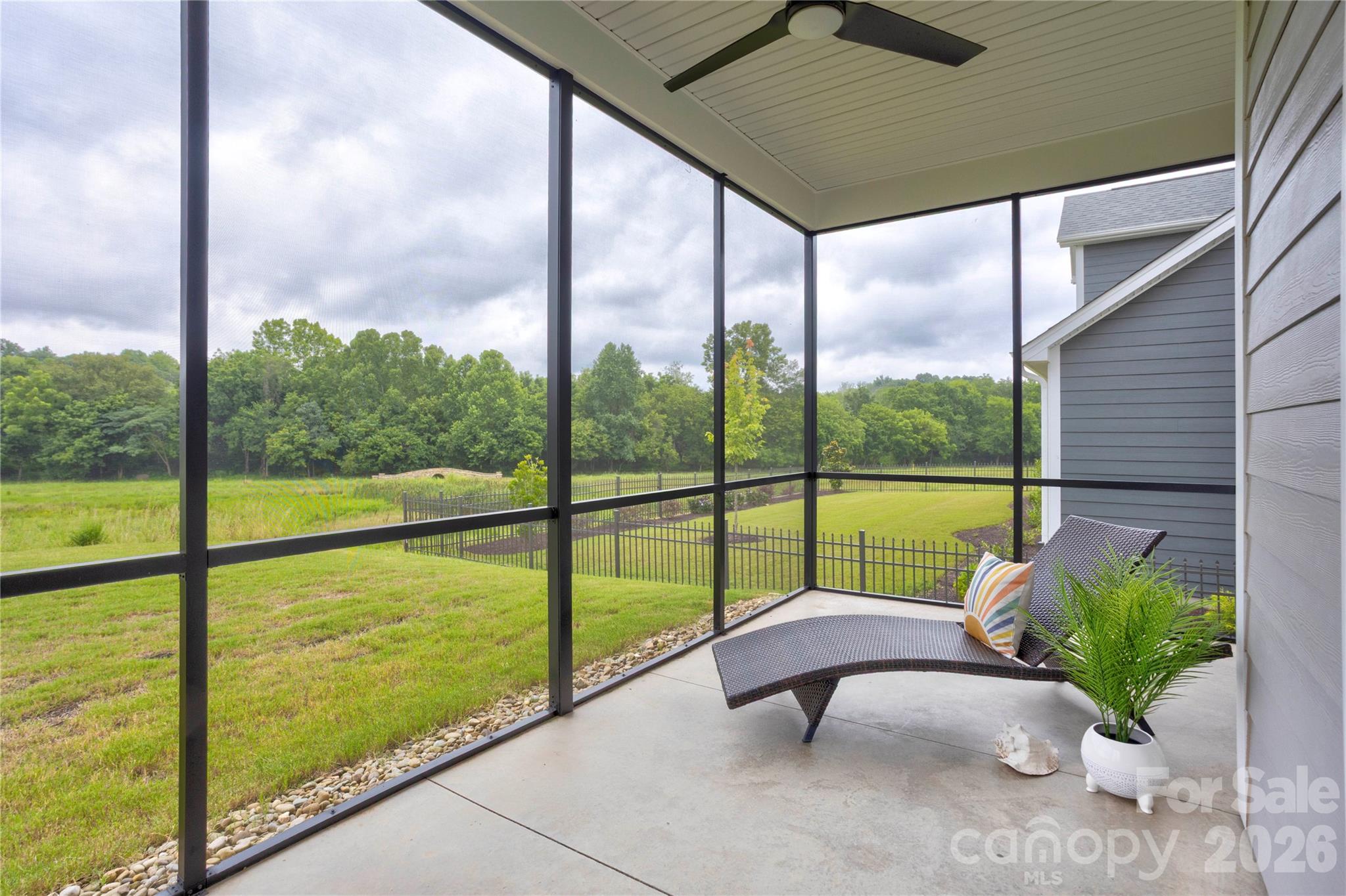 Back porch overlooking Trail with Lighted Bridge at night - 471 Lucky Drive NW, Concord