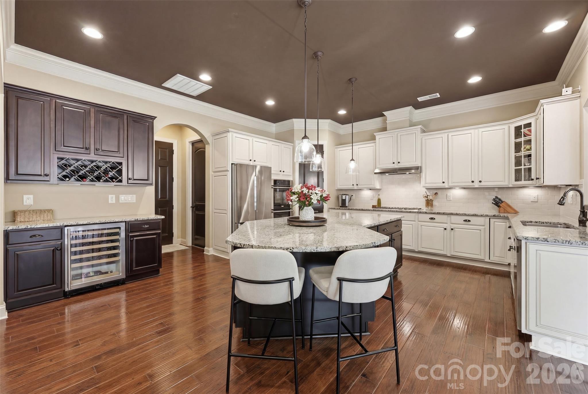 Kitchen, double ovens, large island, thermador cooktop, rollout cabinet drawers, wine fridge - 8094 Clems Branch Road, Indian Land