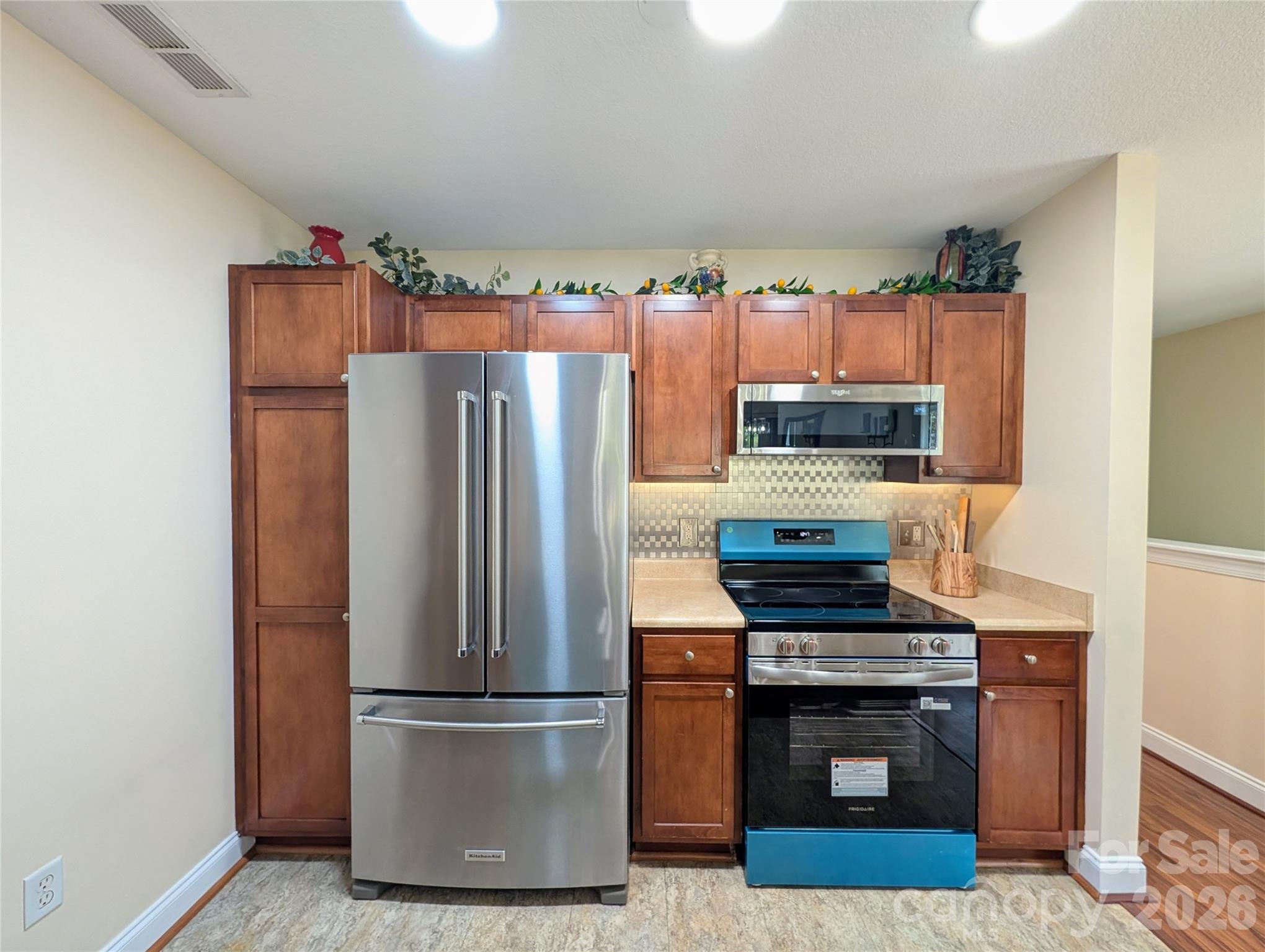 Fridge stays...blue wrap on new stainless stove - 65 Foxden Drive, Fletcher