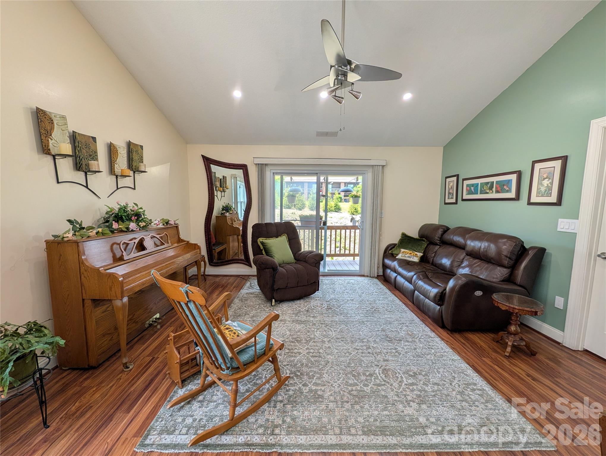 Living room with vaulted ceiling and stainless fan - 65 Foxden Drive, Fletcher