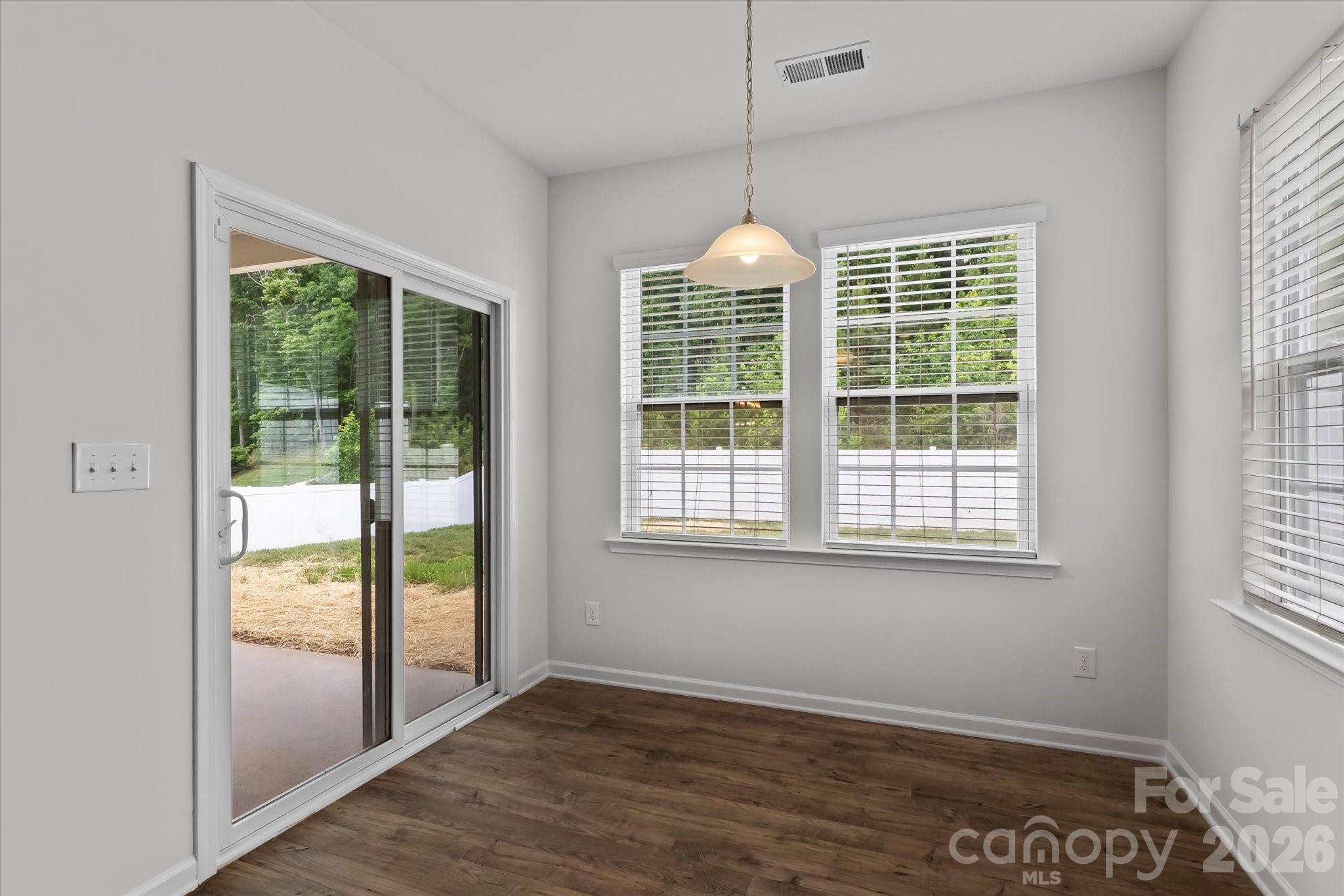 Breakfast area with access to the covered back porch - 188 Cherry Birch Street, Mooresville
