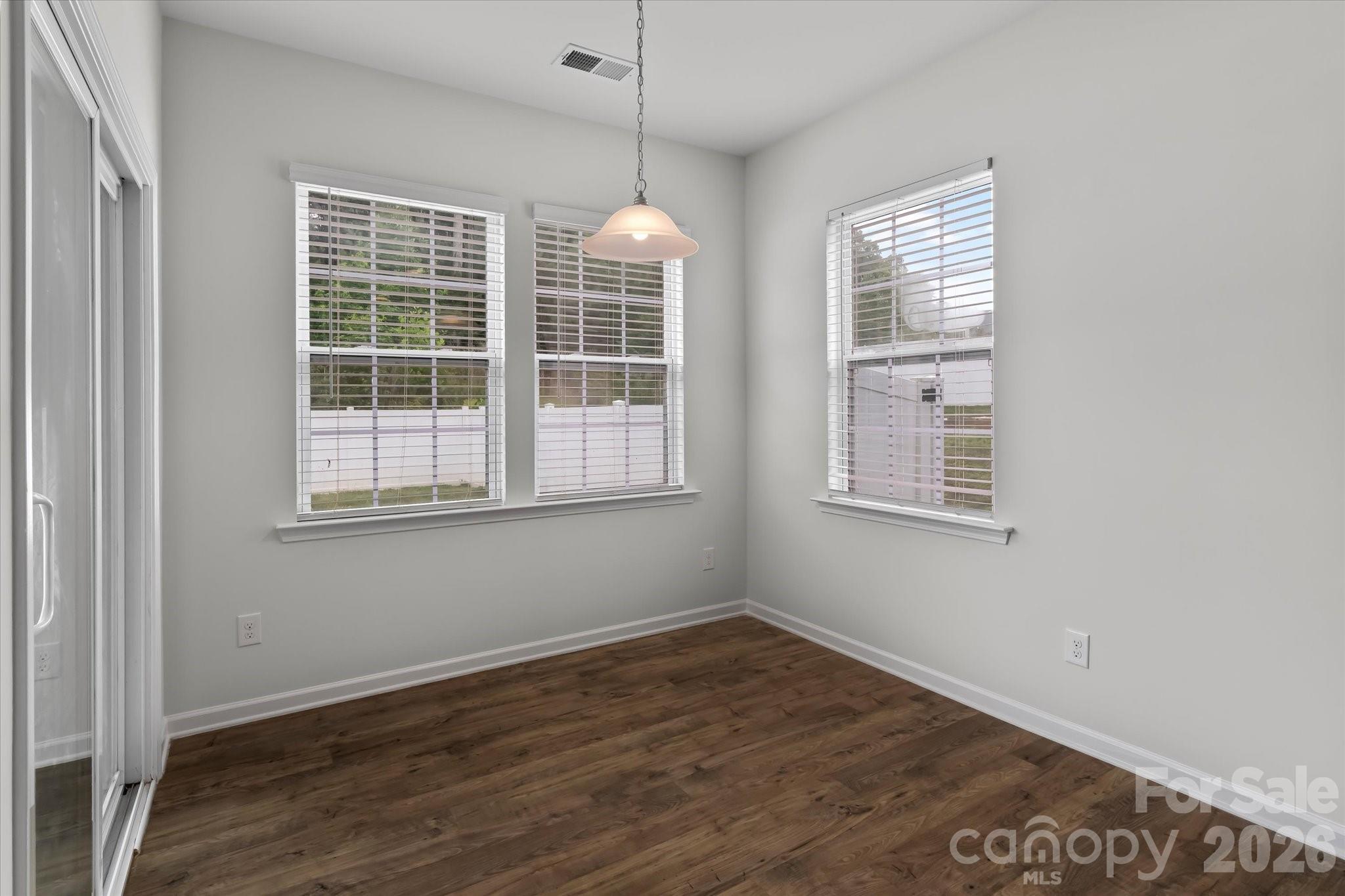 Breakfast area with access to the covered back porch - 188 Cherry Birch Street, Mooresville