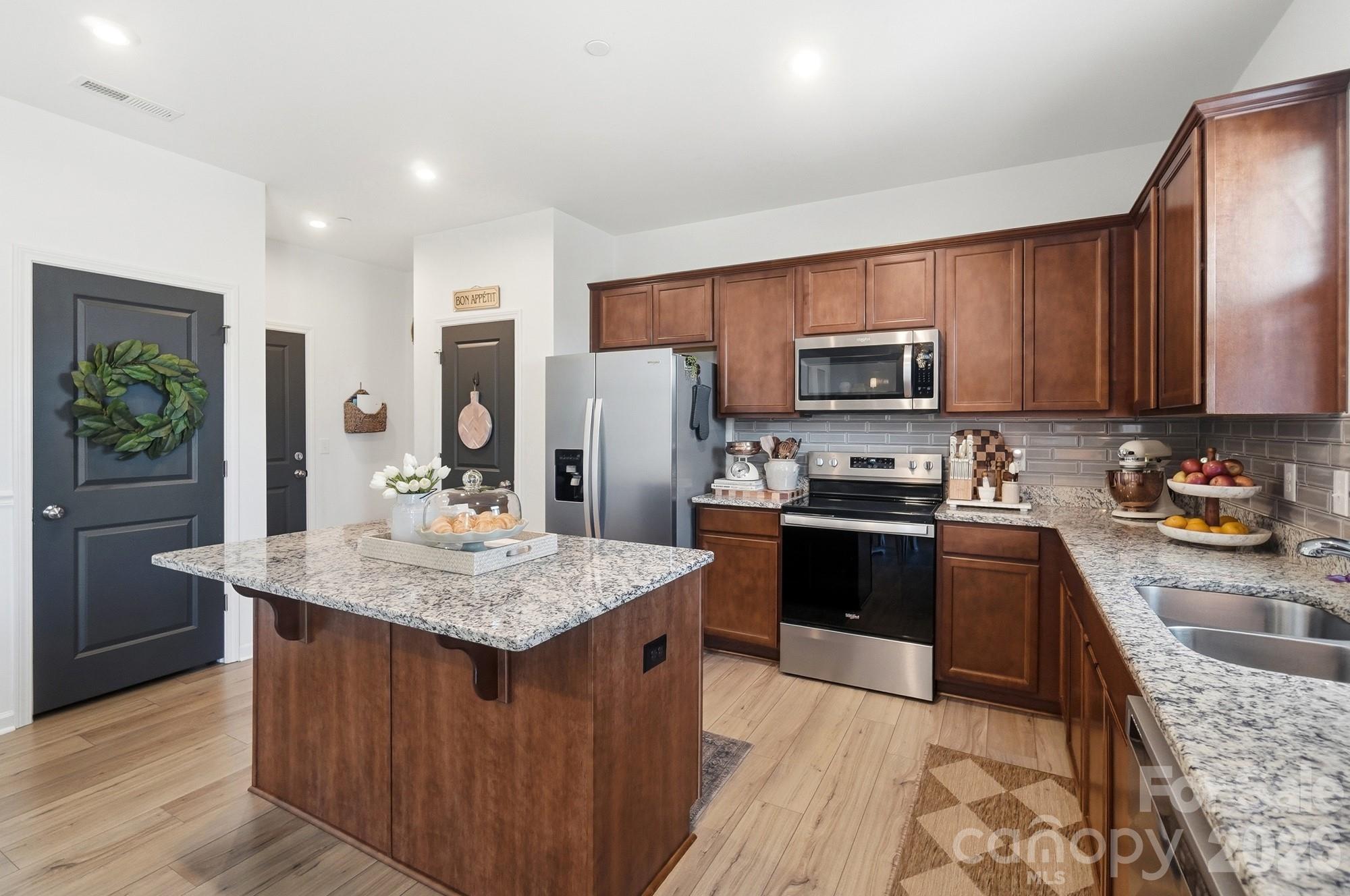 This kitchen not only has all the cabinet space but a ton of storage & eat-in area! - 1246 Nesters Store Place SW, Concord