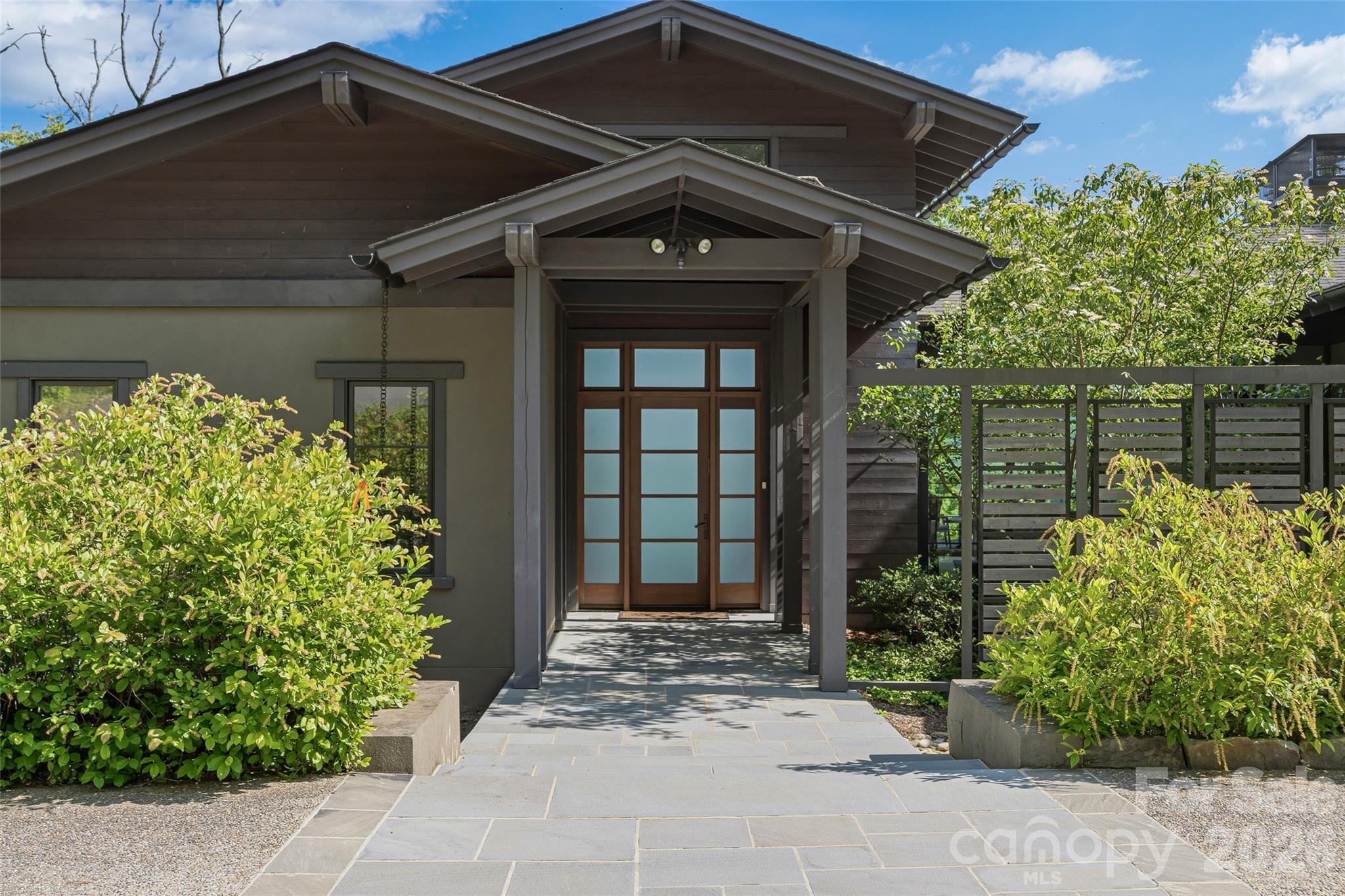 Inviting covered entry framed by native landscaping - 1121 Timberbluff Way, Arden