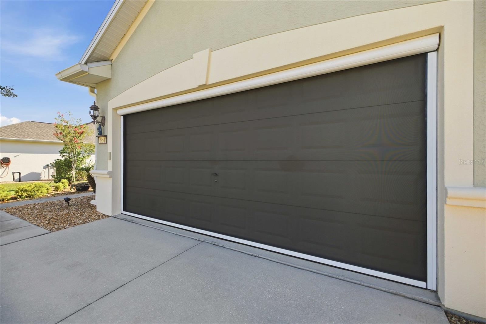 Remote garage door screen - 6951 SW 94TH CT, OCALA