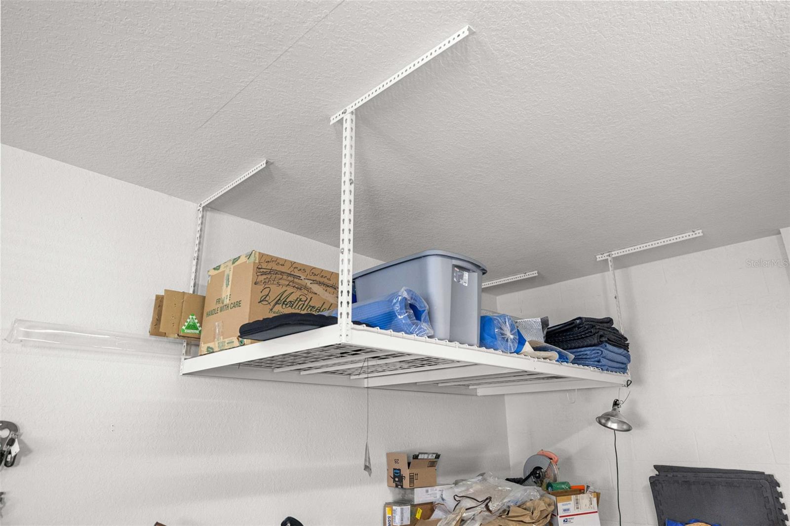 Overhead storage in garage. - 6951 SW 94TH CT, OCALA