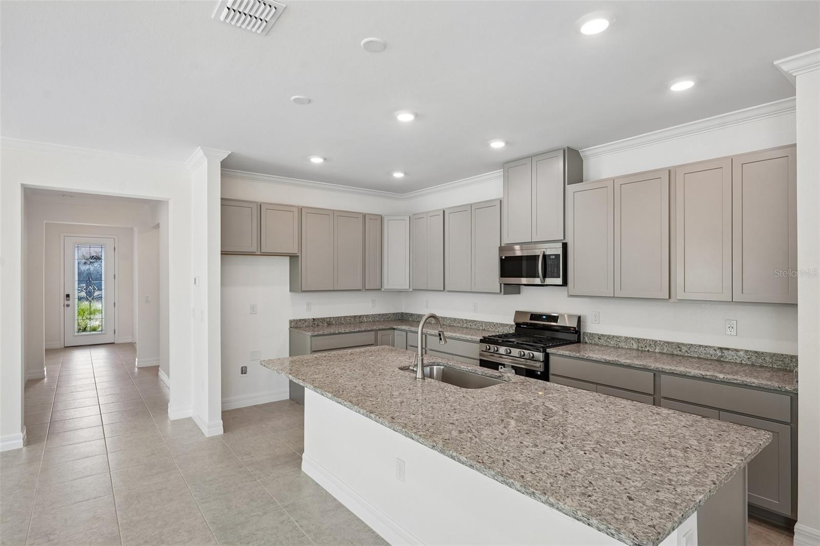 Gorgeous Kitchen, Oversized Island with Granite Countertops & Stainless Appliances - 25503 CALUSA DR, PUNTA GORDA
