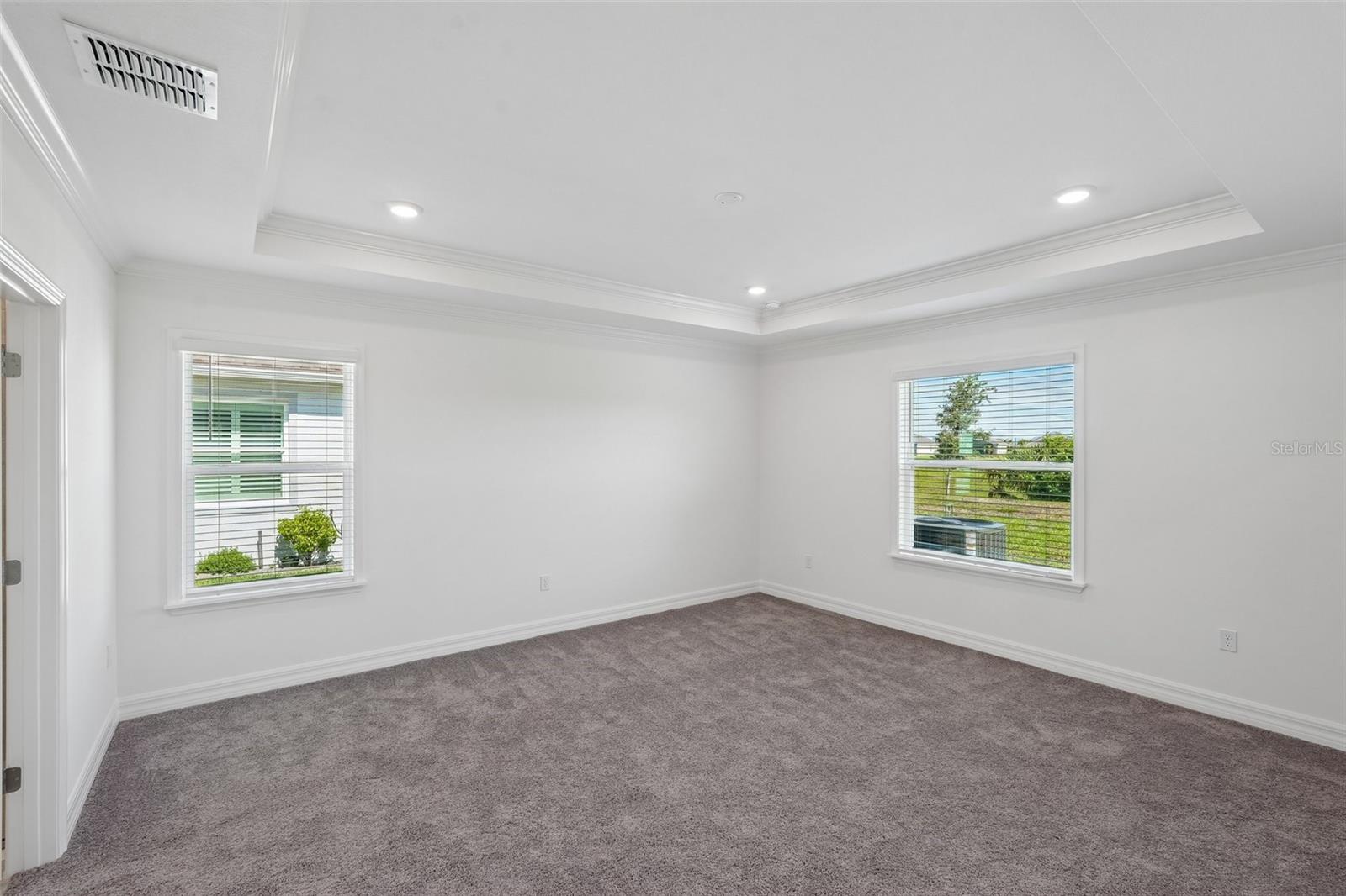 Primary Bedroom with Tray Ceiling - 25503 CALUSA DR, PUNTA GORDA