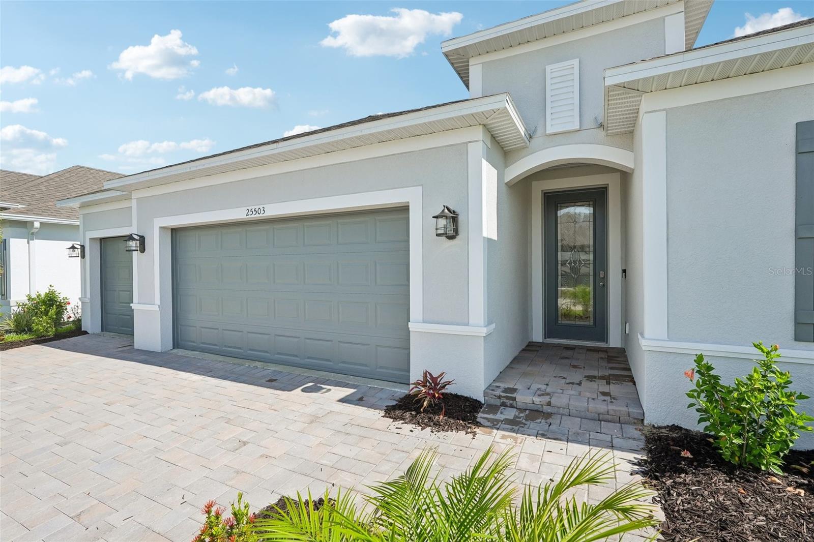 Covered Entry with glass door - 25503 CALUSA DR, PUNTA GORDA
