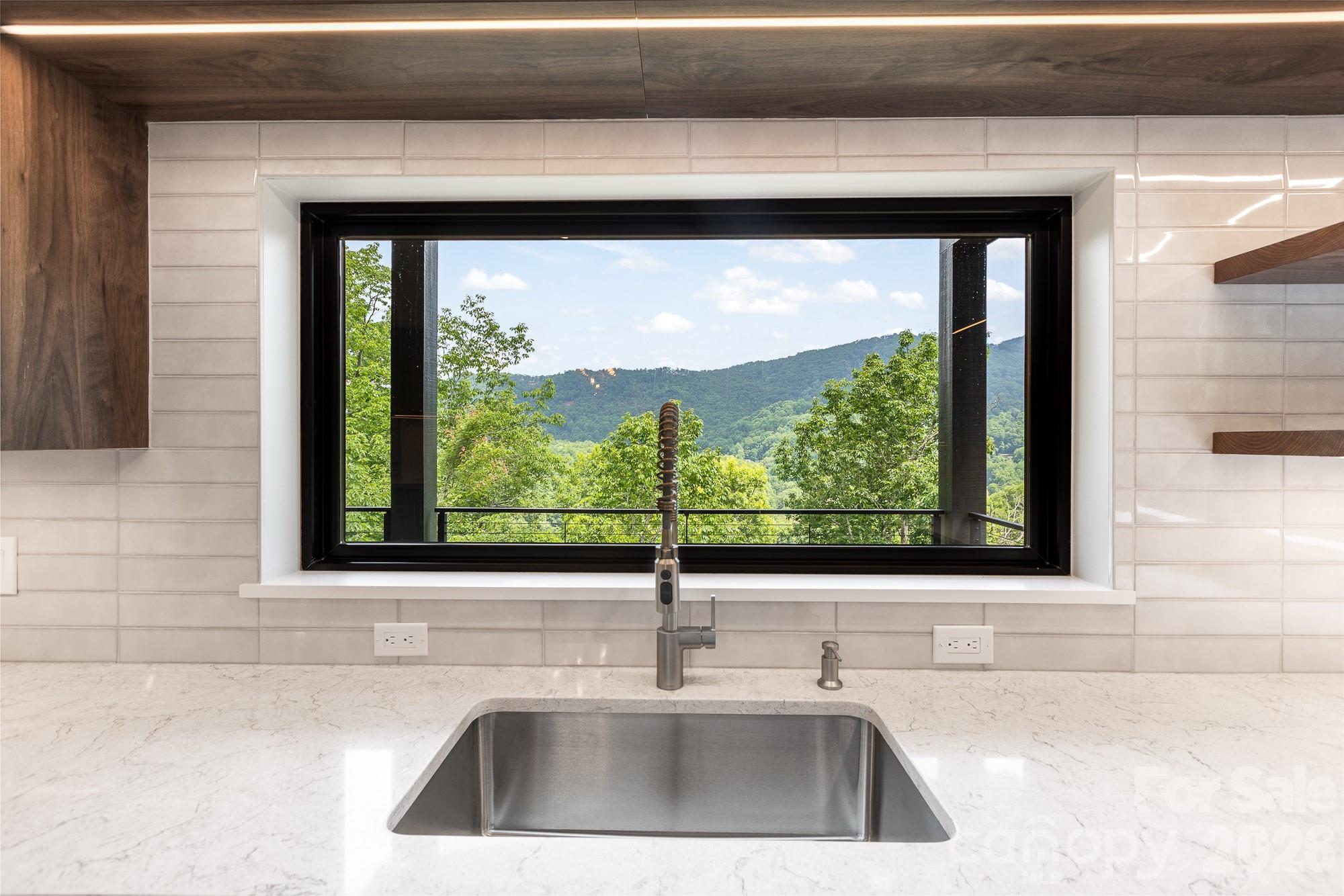 Kitchen sink window view. - 60 King Horn Ridge, Waynesville