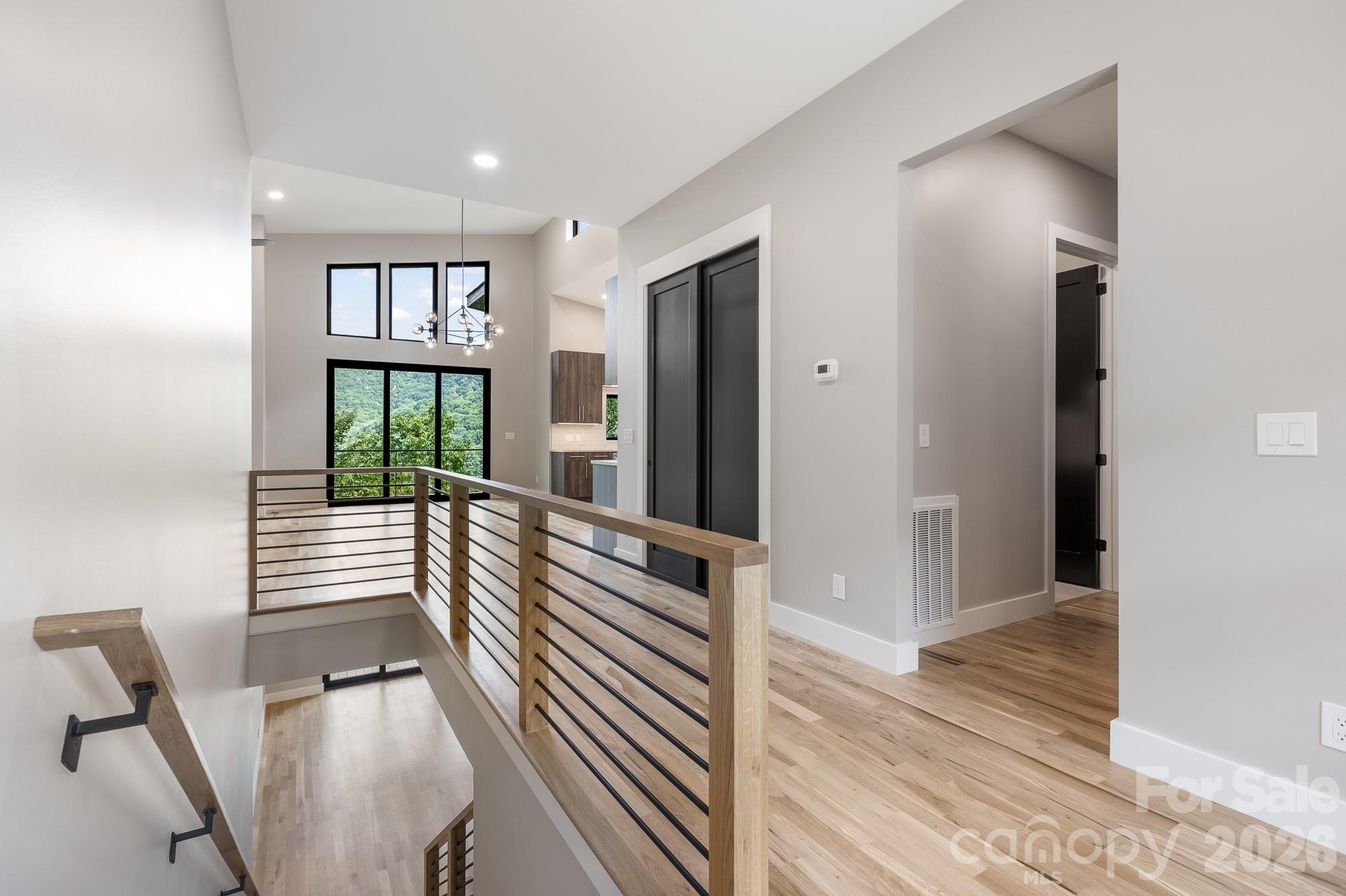 Entry, stairs and view through common area. - 60 King Horn Ridge, Waynesville