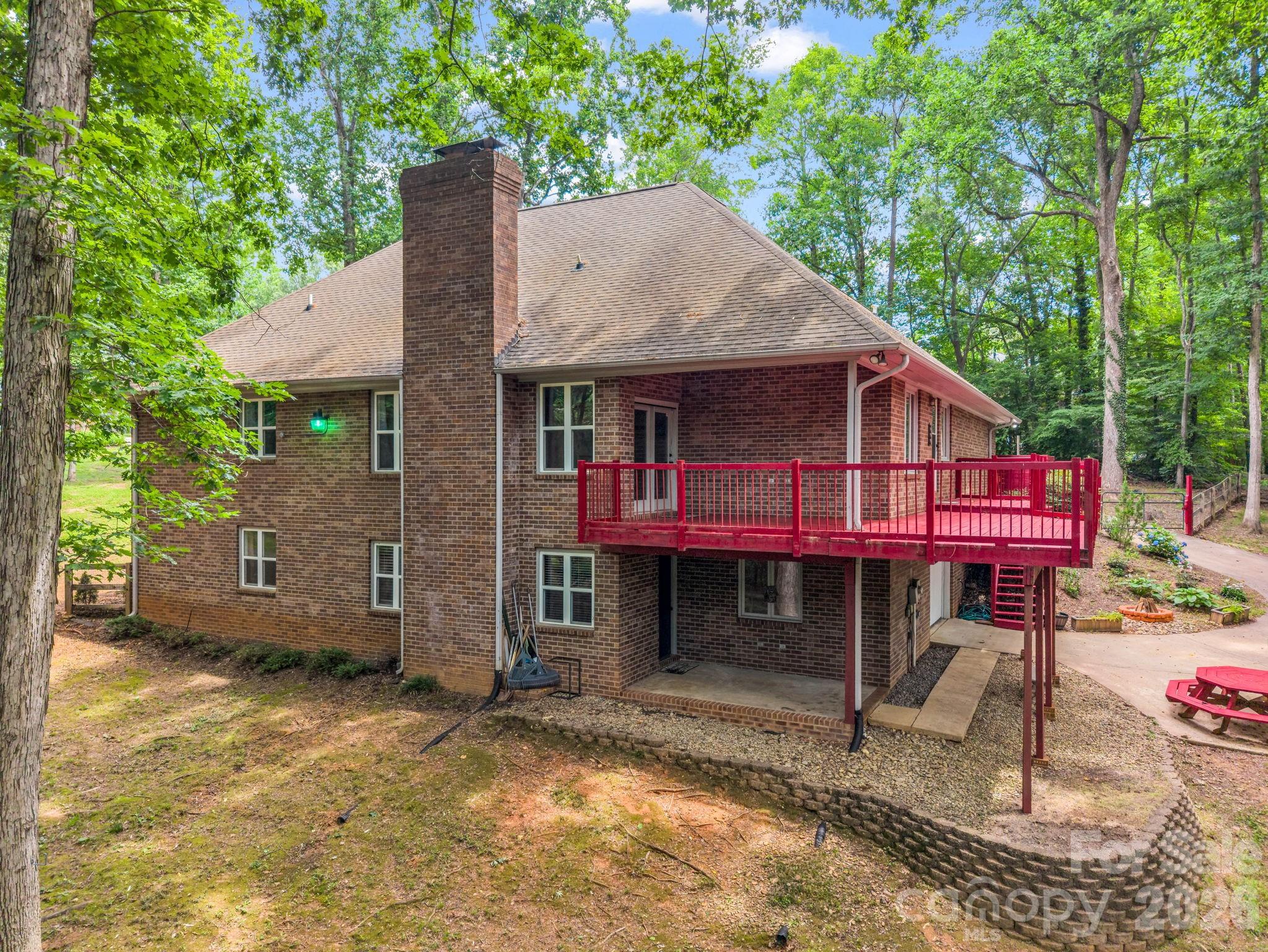 Covered deck overlooking backyard - 1810 Arbor Way Drive, Shelby