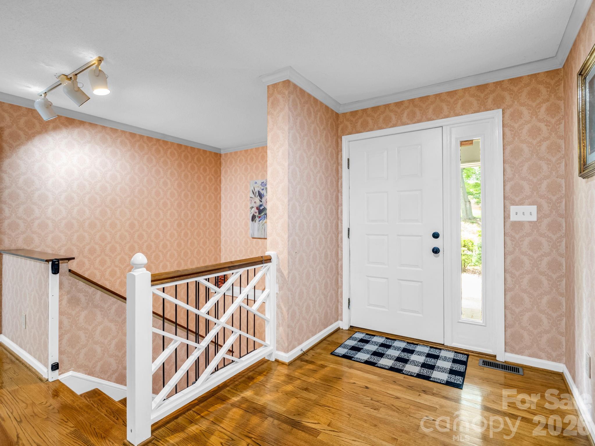 Entry open to living area, stairs to lower level - 1810 Arbor Way Drive, Shelby