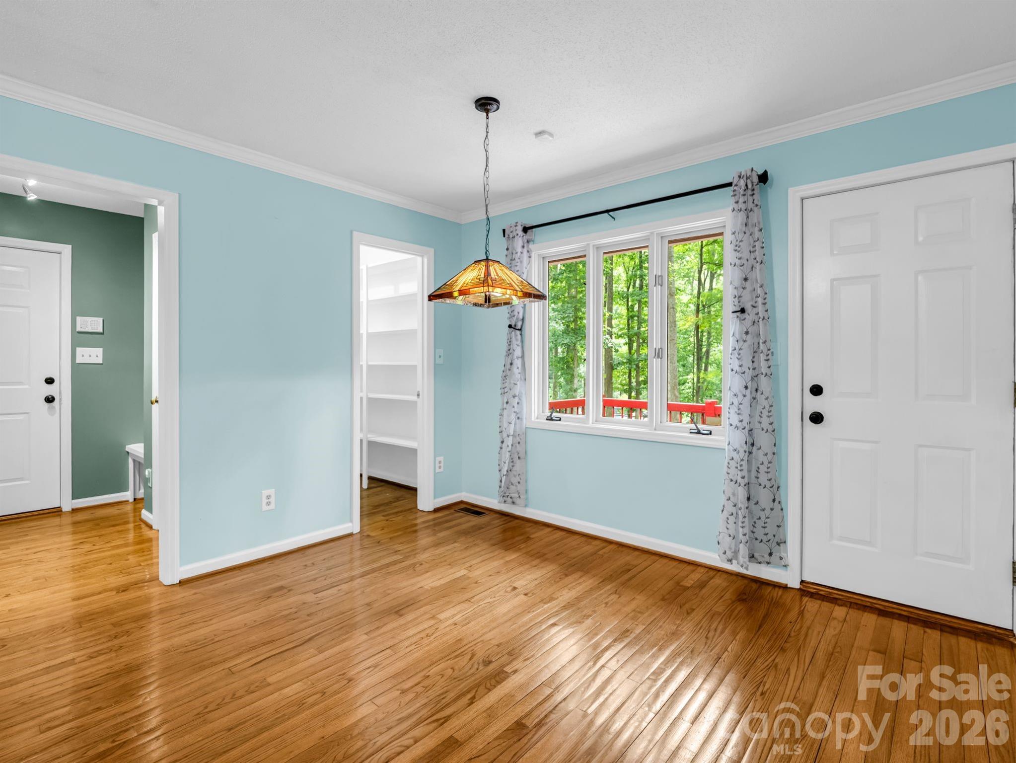 Breakfast area at end of kitchen, door opens to side deck, laundry to the left - 1810 Arbor Way Drive, Shelby