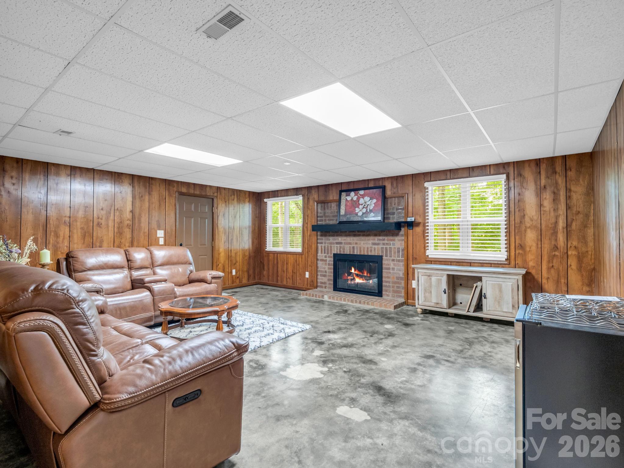 Family room with gas fireplace in lower level - 1810 Arbor Way Drive, Shelby