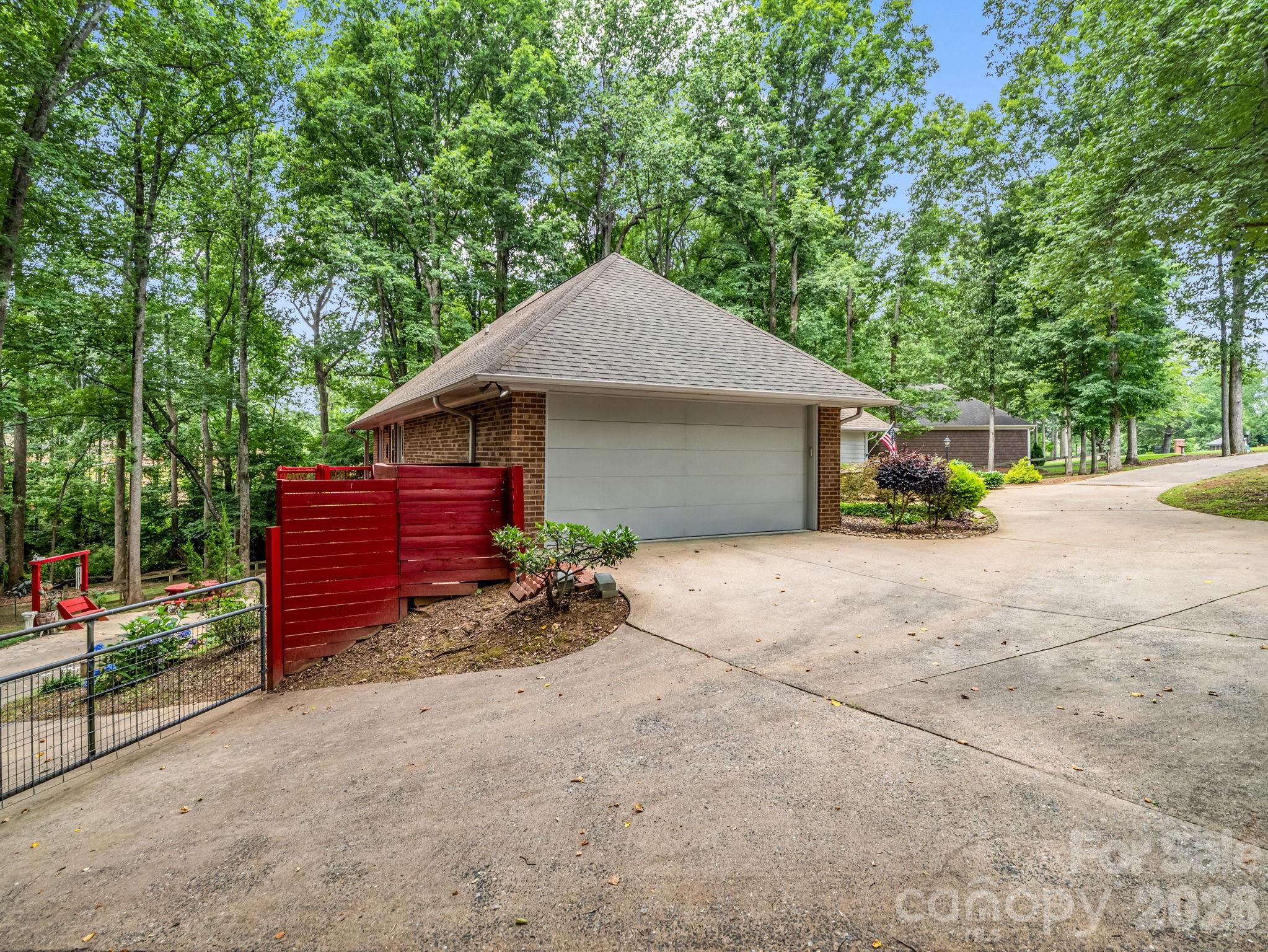 Gate on left goes to 1 car garage and workshop in basement - 1810 Arbor Way Drive, Shelby