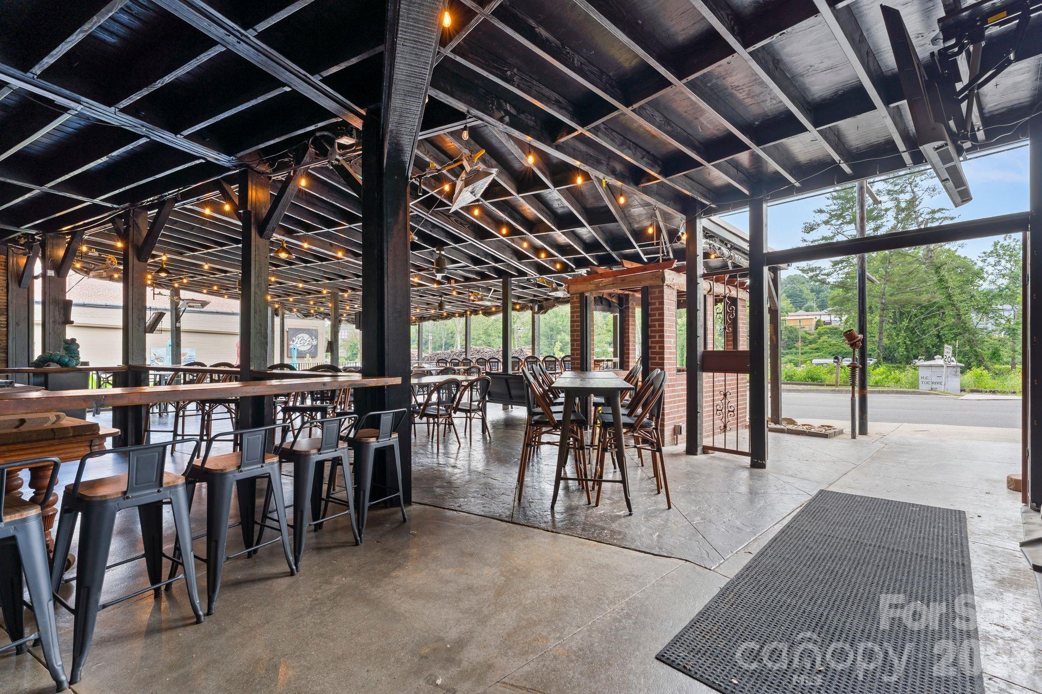 bottom level dining outside - 69 Locust Street, Spruce Pine
