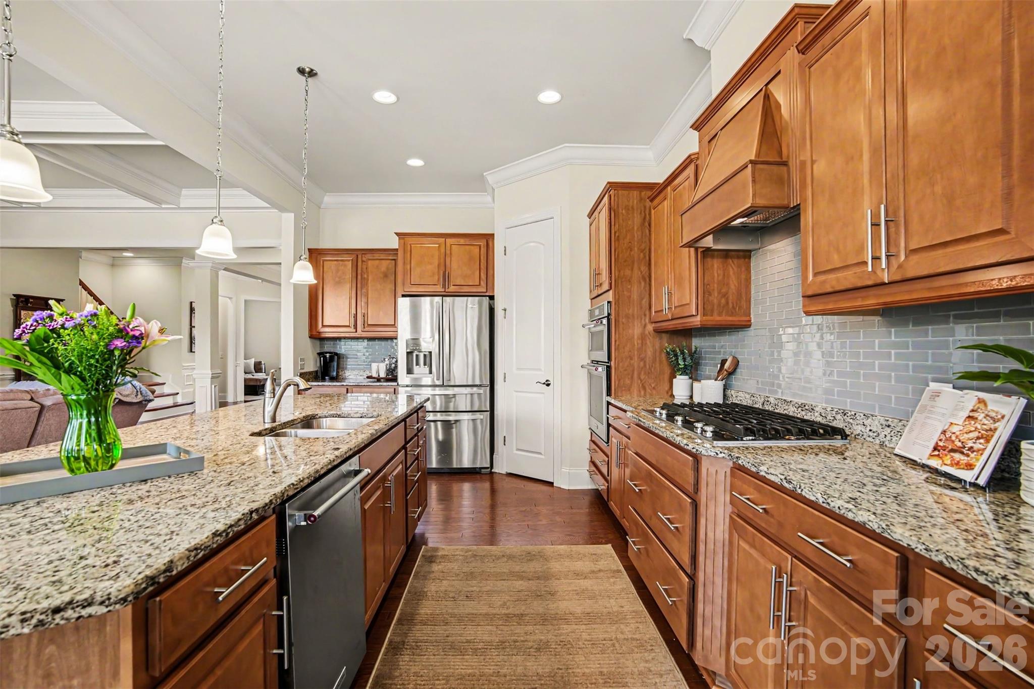 Chef's kitchen with gas cooktop, hood and wall oven/microwave combo - 3605 Jumprock Road, Indian Land