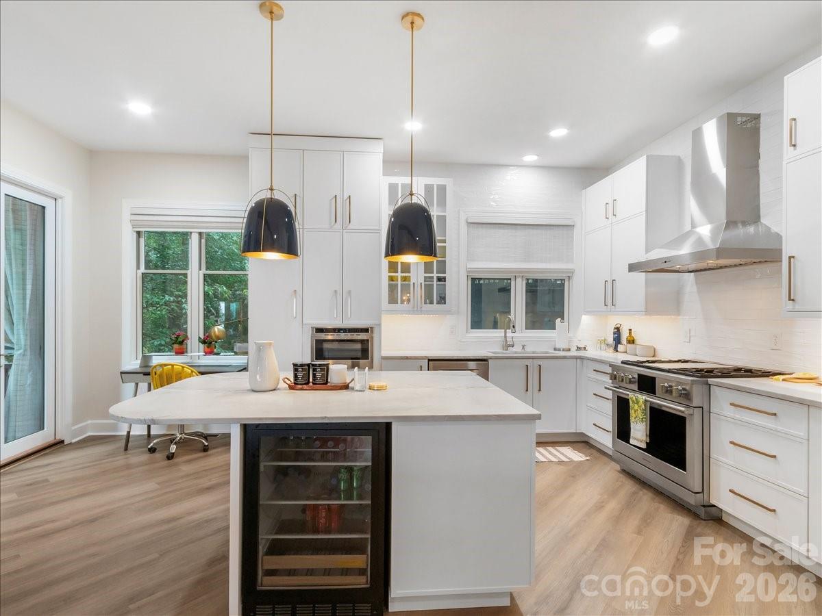 KITCHEN ISLAND WITH BEVERAGE REFRIGERATOR - 530 Andrew Banks Road, Burnsville