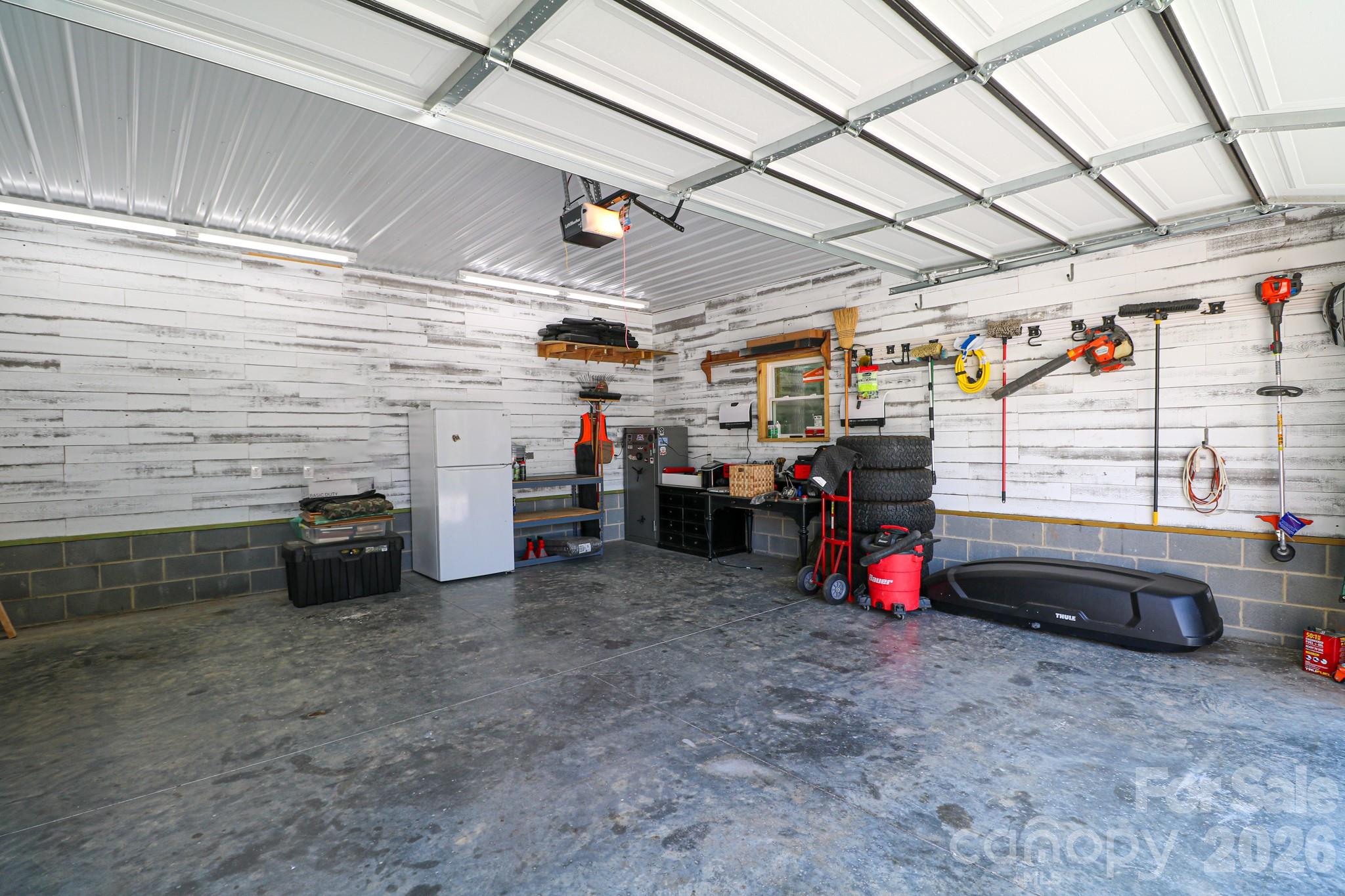 Inside workshop with remote garage door. - 120 Wellington Drive, Salisbury