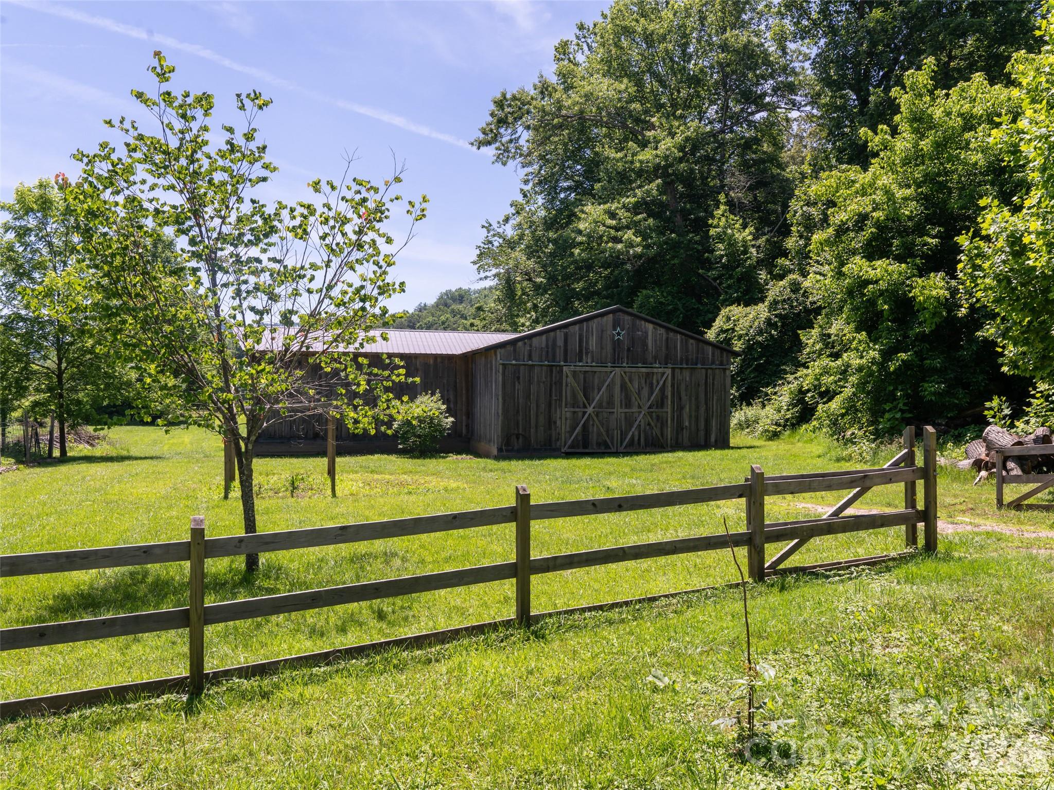Entrance to the front pasture and larger barn - 508 Avery Creek Road, Arden