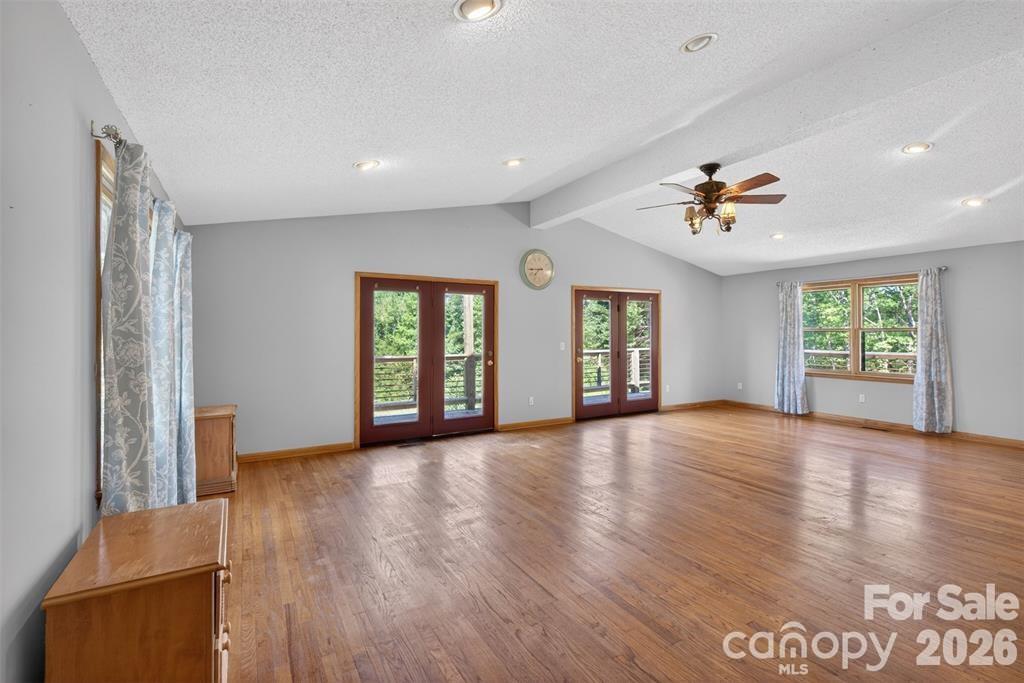 View of Great Room. Double doors open to wrap deck. - 00 Misery Ridge Trail, Mill Spring
