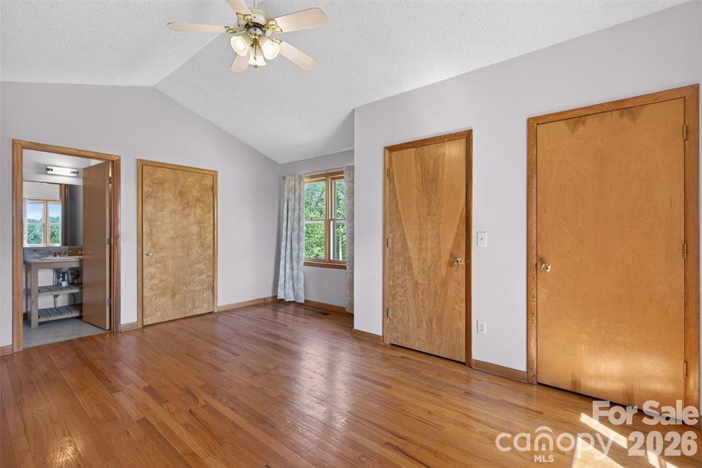 View 2 of primary suite showing bathroom. Entry door to right of bathroom. - 00 Misery Ridge Trail, Mill Spring