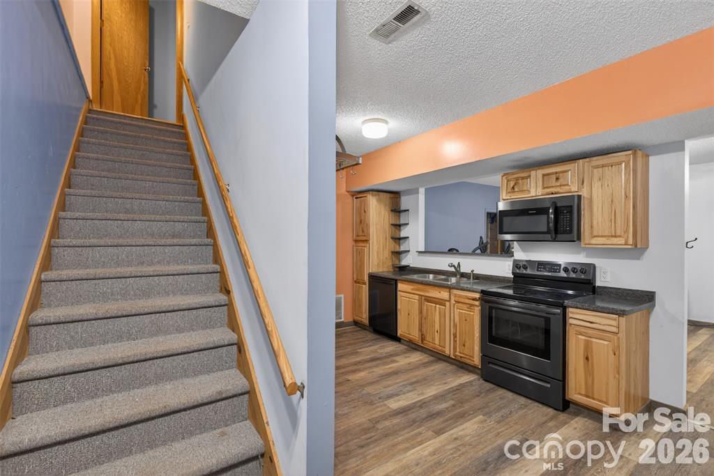 Stairs from basement apartment to upper level. - 00 Misery Ridge Trail, Mill Spring