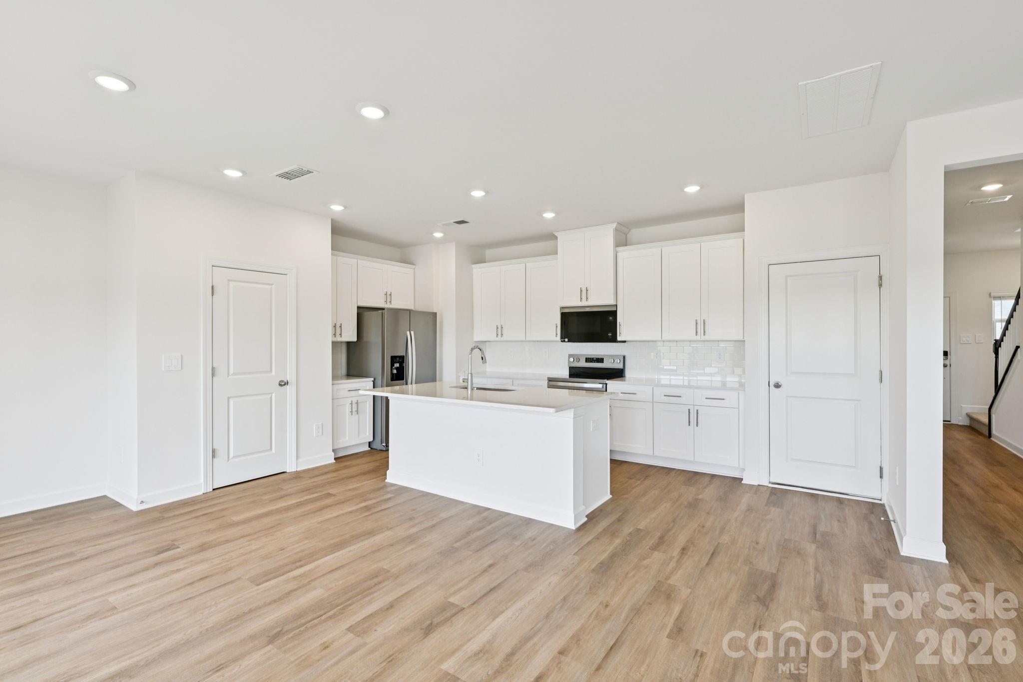 Photo is not of the actual home, but is an inspirational photo of builder’s model home and may depict options, furnishings, and/or decorator features that are not included - 1445 Wildflower Street, Newton