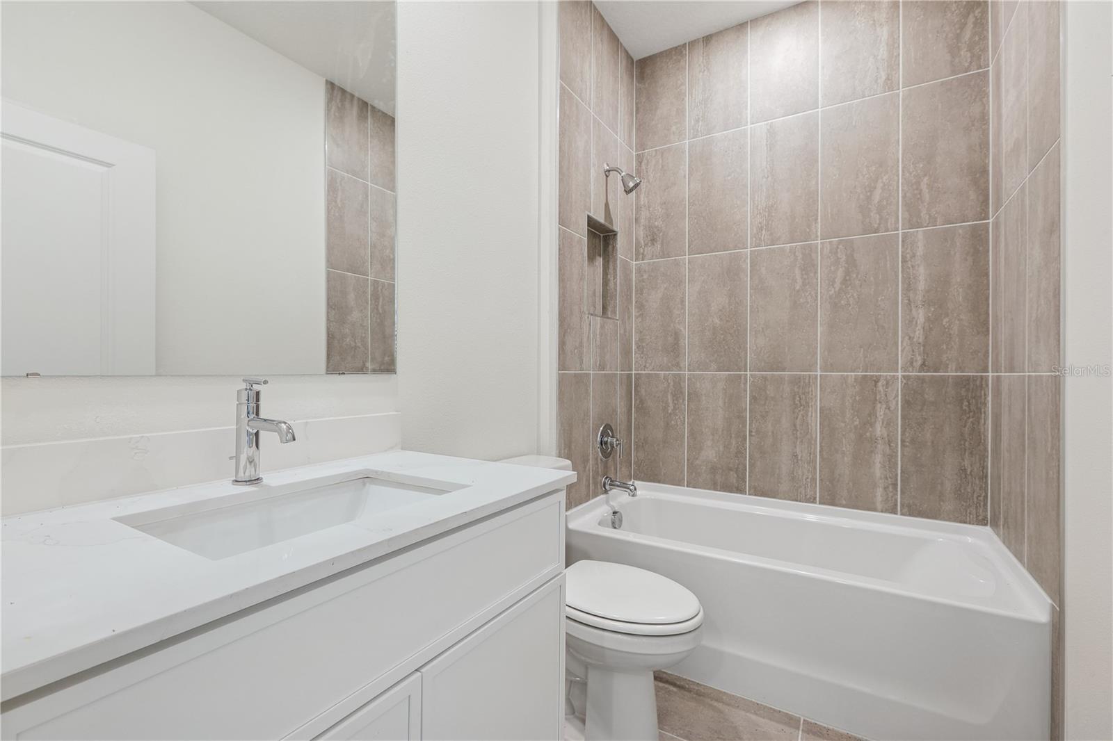 PHOTOS OF SAME MODEL WITH SIMILIAR FINISHES - 86 SPRINGWOOD DR, PALM COAST