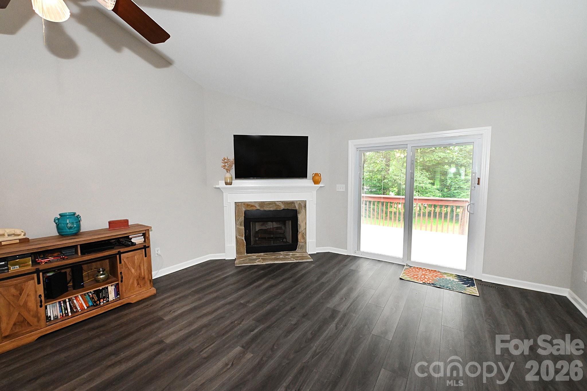 Living room with easily maintained vinyl plank flooring - 1035 E 24th Street, Newton