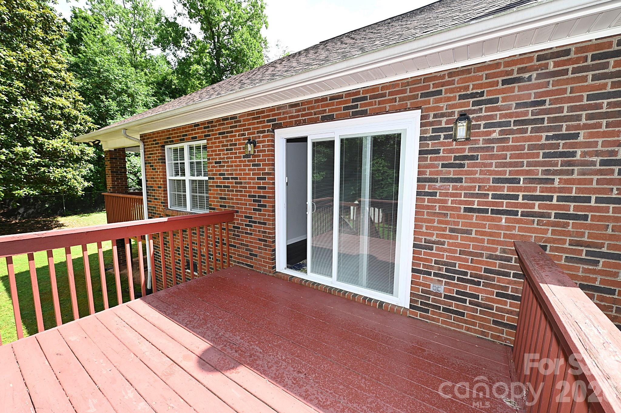 Patio door leads to rear deck - 1035 E 24th Street, Newton