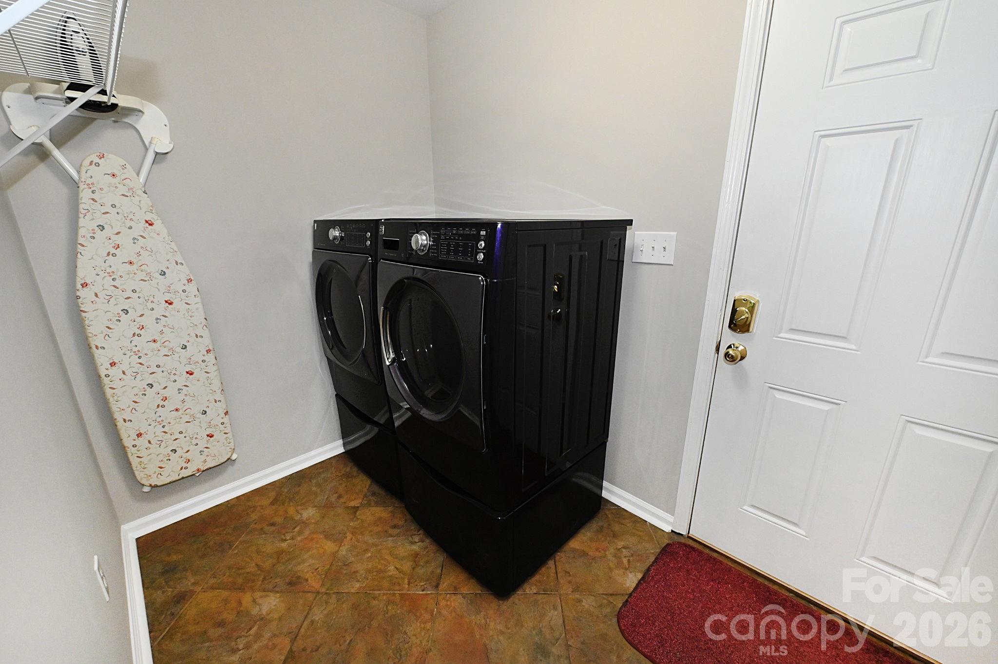 Laundry room with door to the garage - 1035 E 24th Street, Newton
