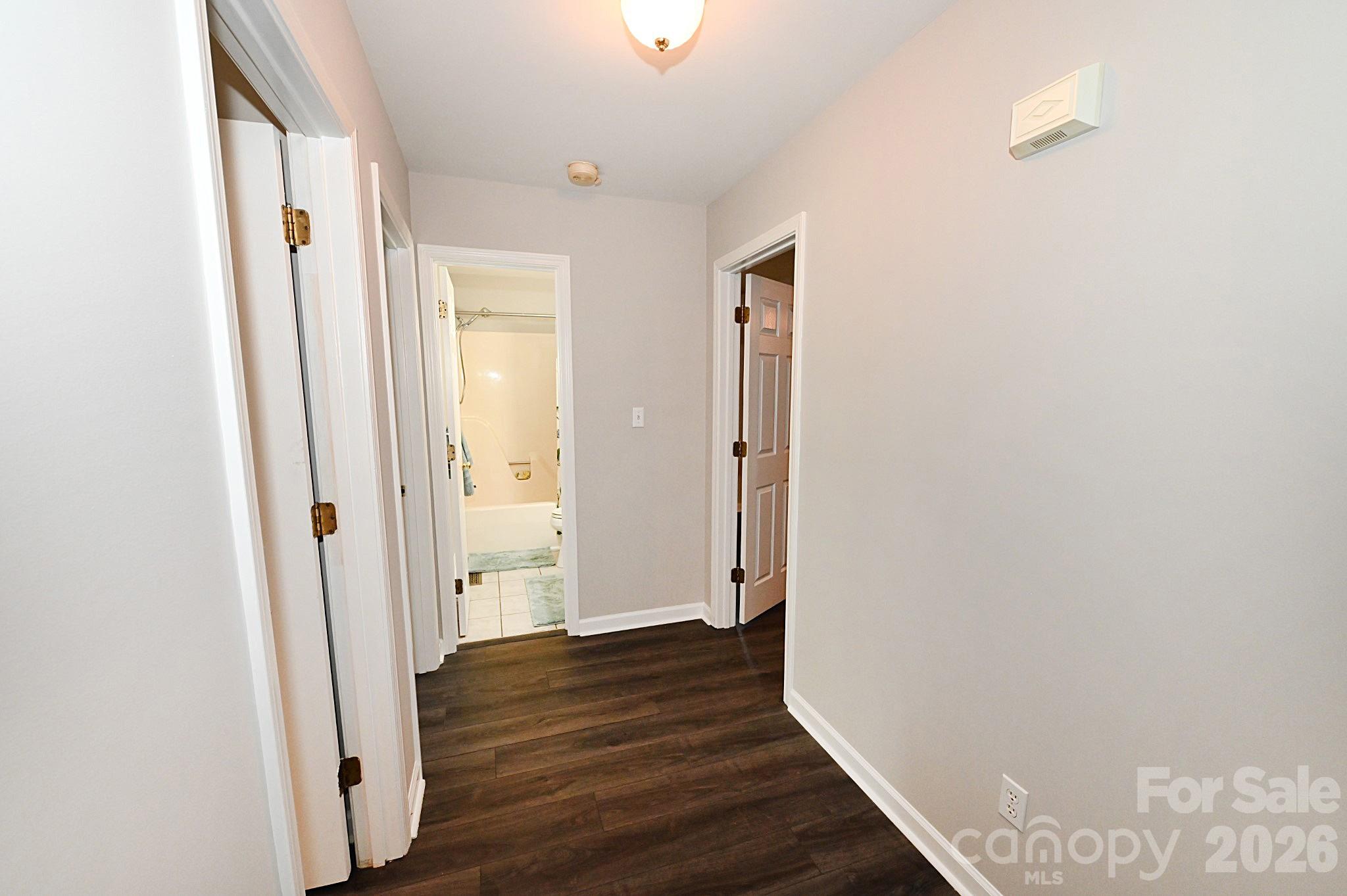 To the left of the entrance way is the hallway to 3 bedrooms and 2 bathrooms - 1035 E 24th Street, Newton