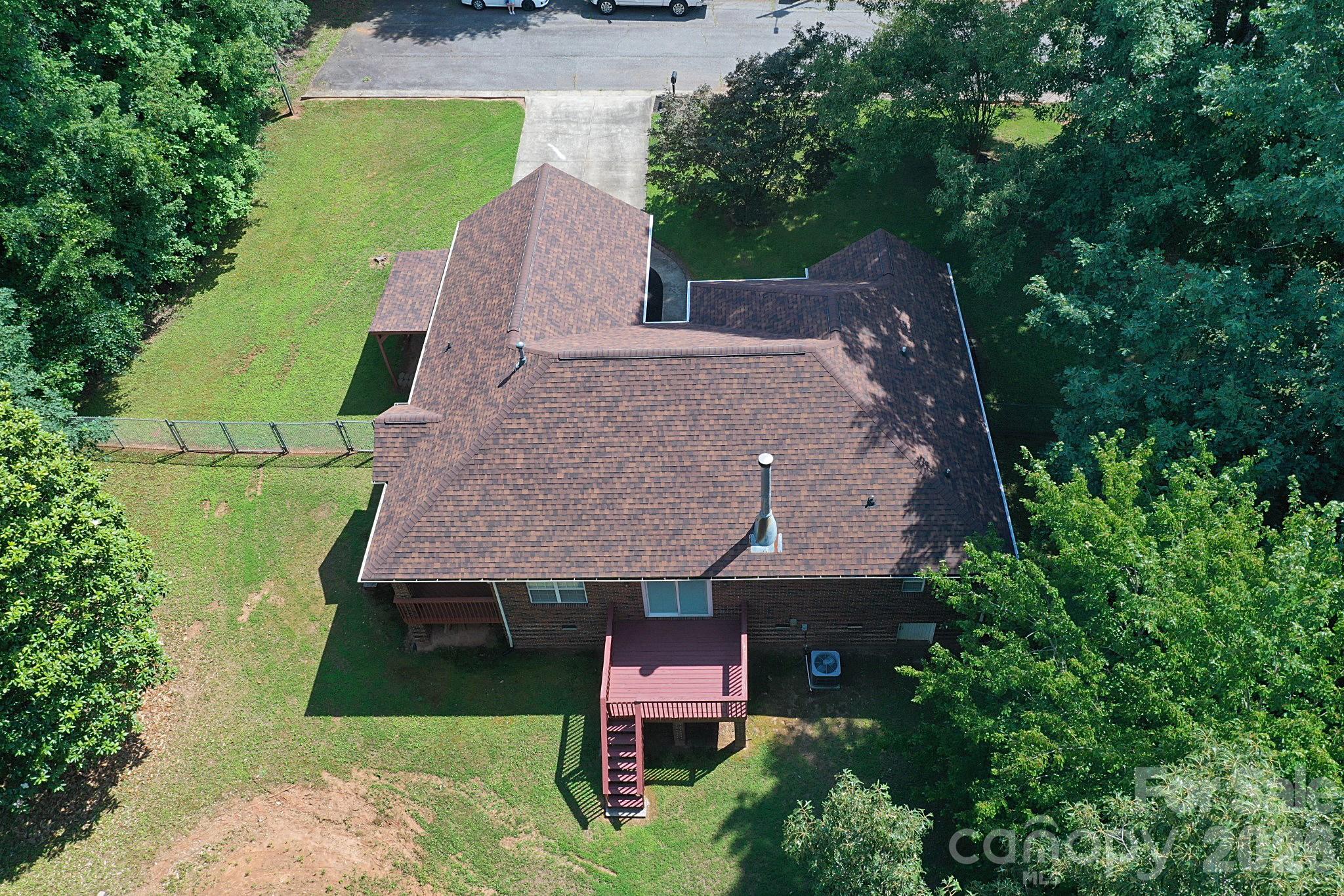 Aerial view of the home with fenced in backyard. Home located at the end of the street - 1035 E 24th Street, Newton