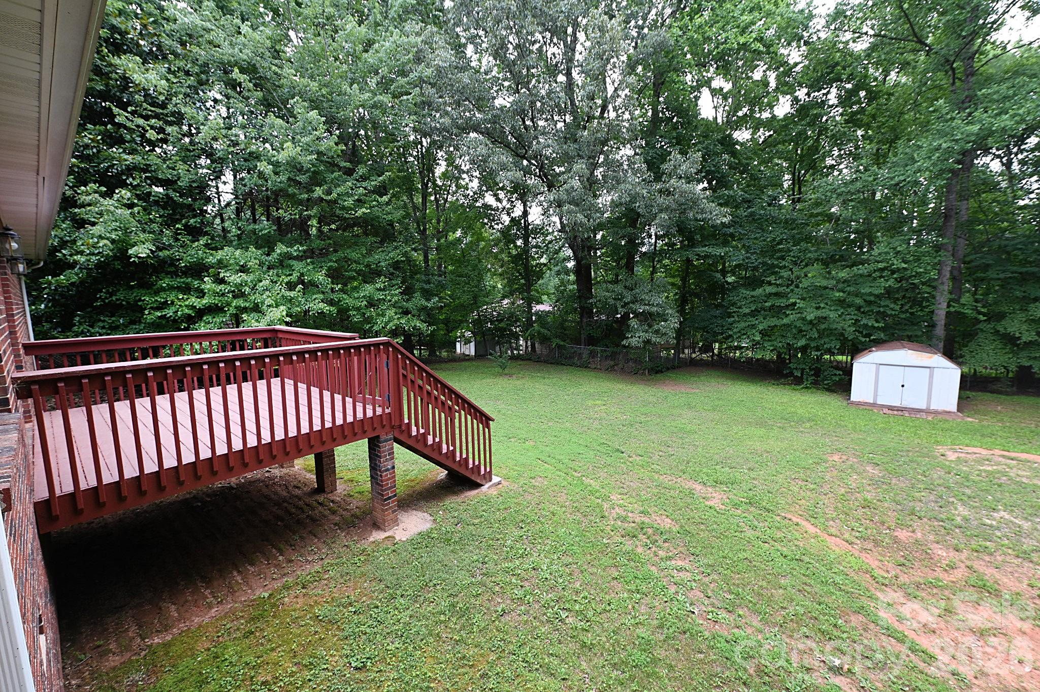 Beautiful backyard offering privacy galore - 1035 E 24th Street, Newton