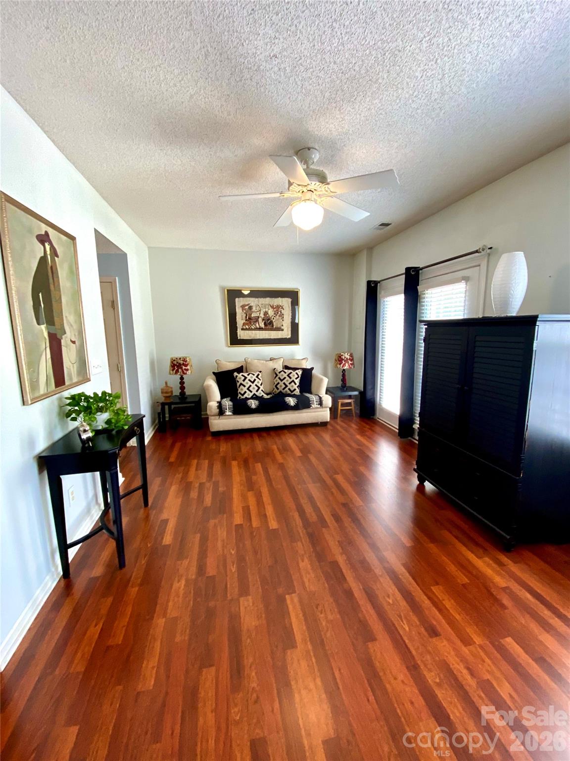 Living Room view near Kitchen area with lots of natural light thru windows facing the rear of the townhome. - 6025 Creft Circle, Indian Trail