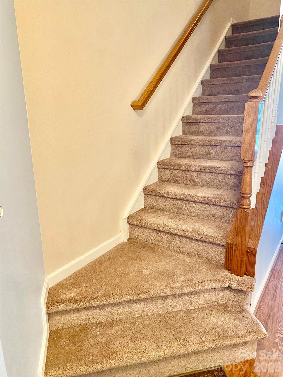 Staircase to the left of the front door foyer area. - 6025 Creft Circle, Indian Trail