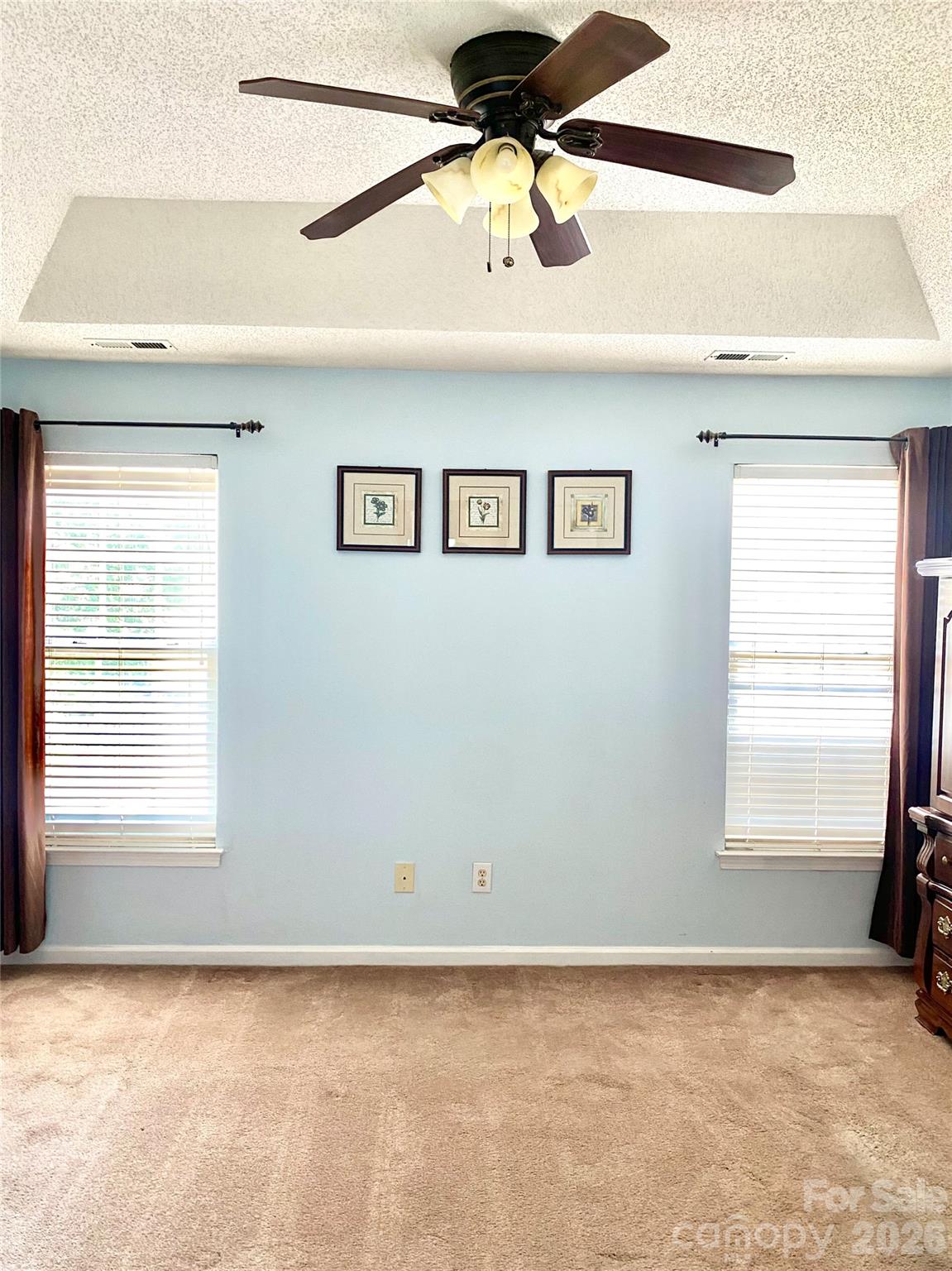Primary Bedroom overlooking patio & green area. - 6025 Creft Circle, Indian Trail
