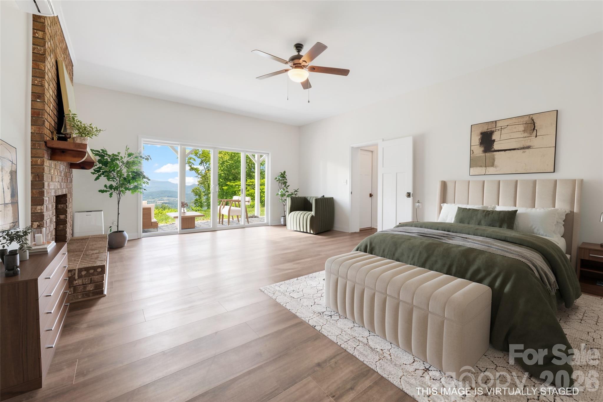 Ensuite lower-level bedroom with wood burning fireplace - 69 Milburn Lane, Hendersonville