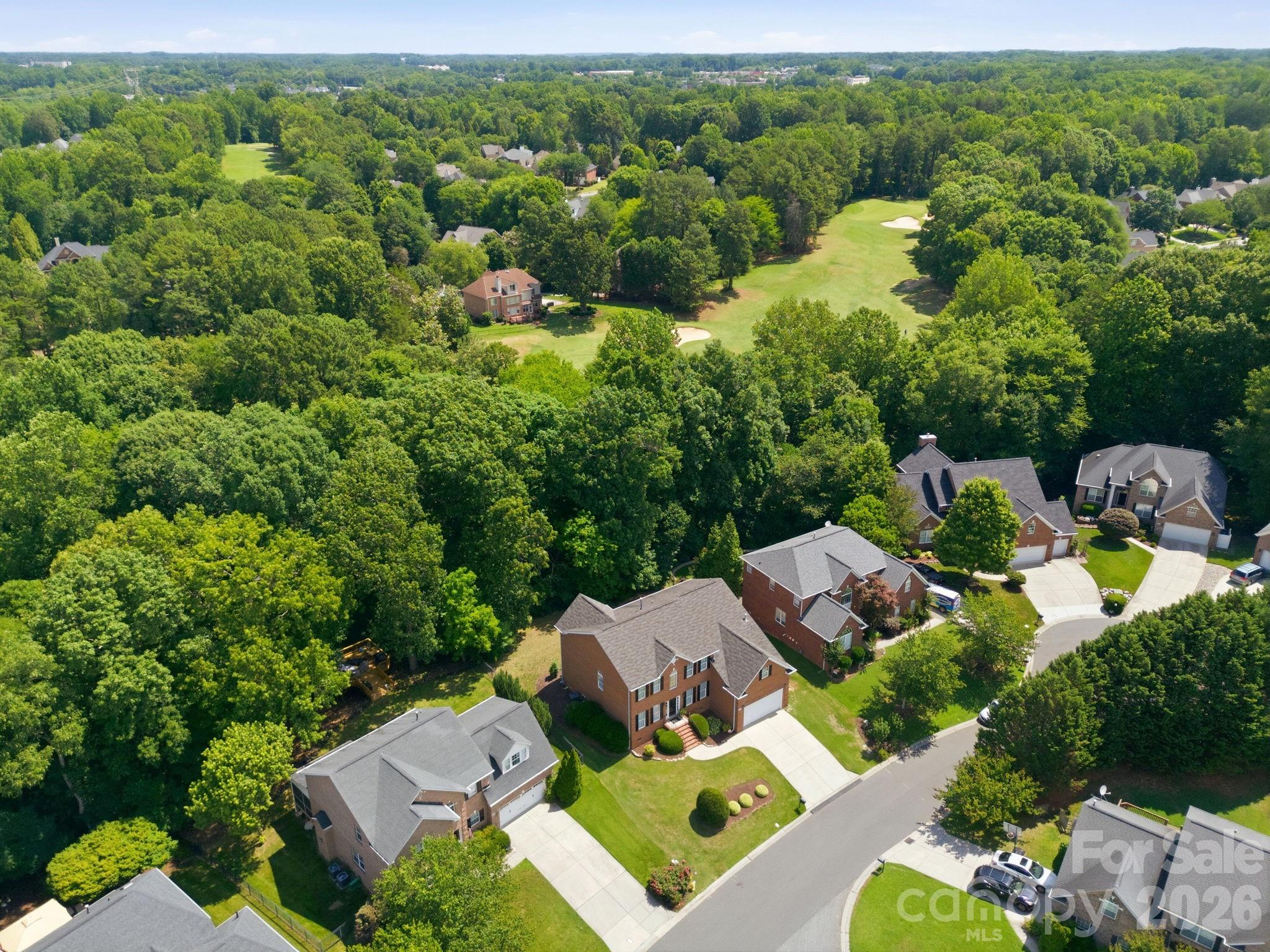 aerial view showcasing the neighborhood public golf course - 9329 Uxbridge Lane, Huntersville