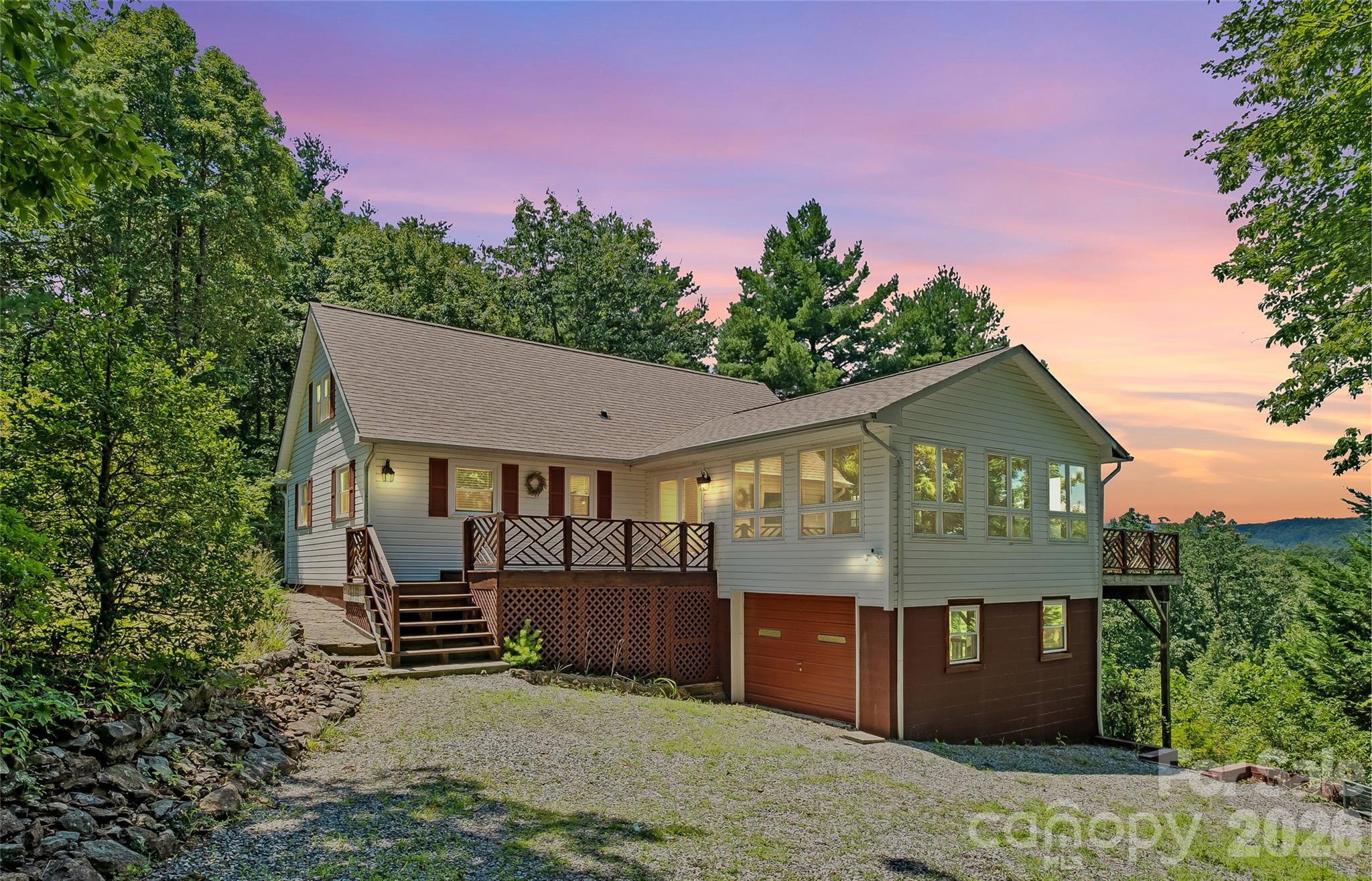 Front exterior at dusk. *Photo has been virtually enhanced.* - 5545 Pine Ridge Drive, Connelly Springs
