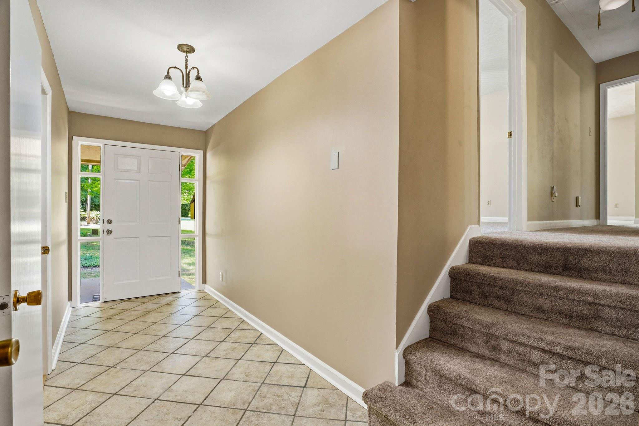 Welcoming foyer sets the tone for this charming, multi-level home. - 2619 Hopewell Church Road, Sherrills Ford