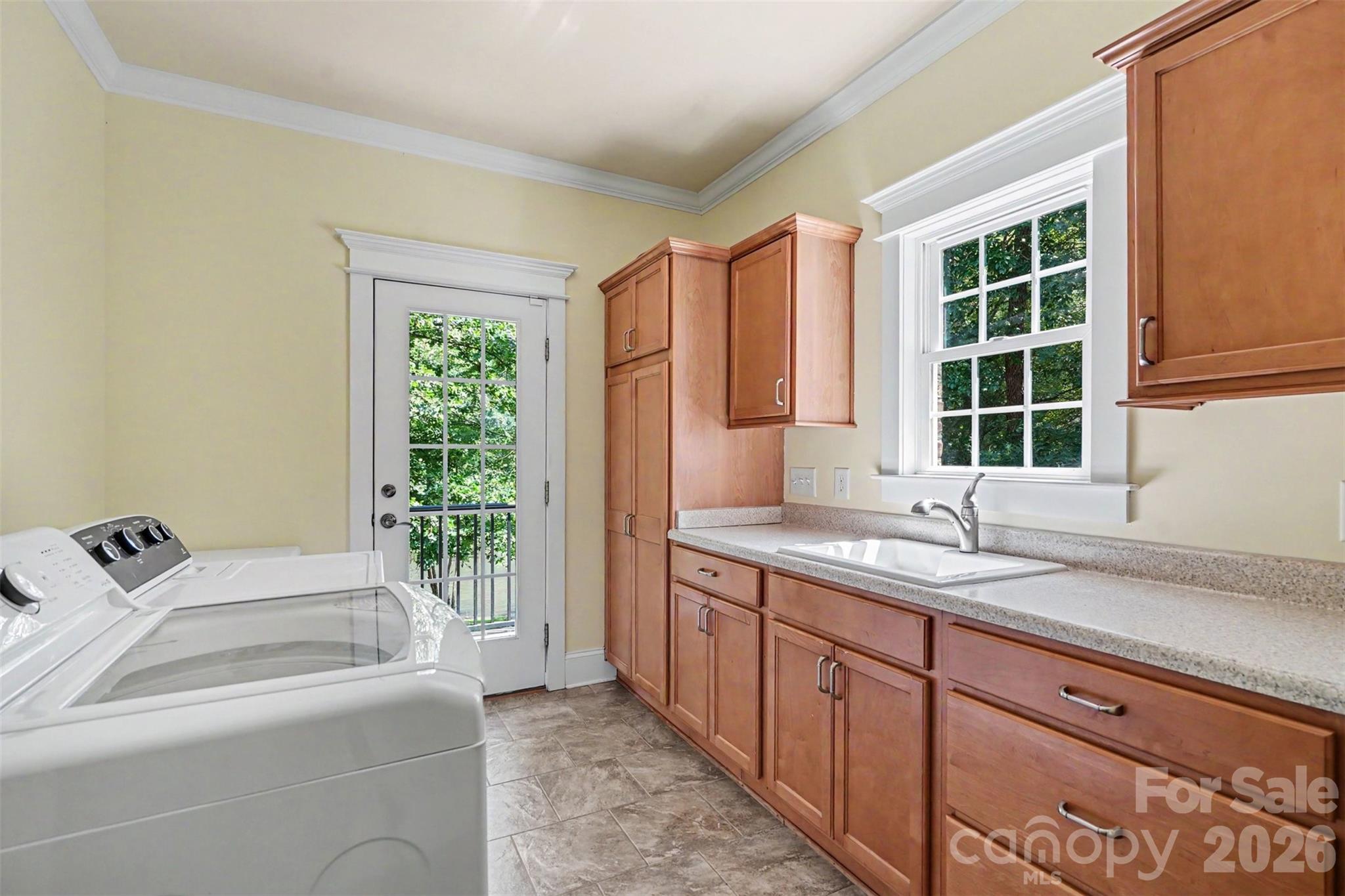 Laundry room with access to the back deck - 162 Twin Lakes Drive, Statesville