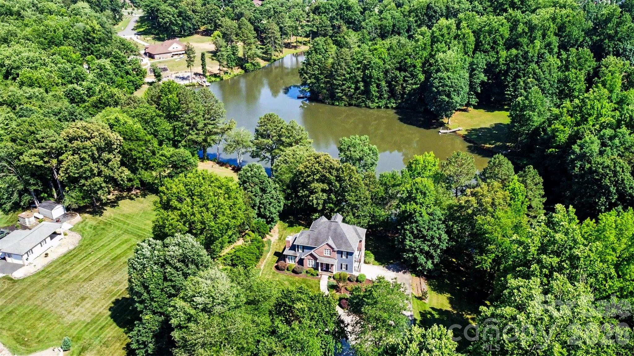 Home is surrounded by trees providing privacy - 162 Twin Lakes Drive, Statesville