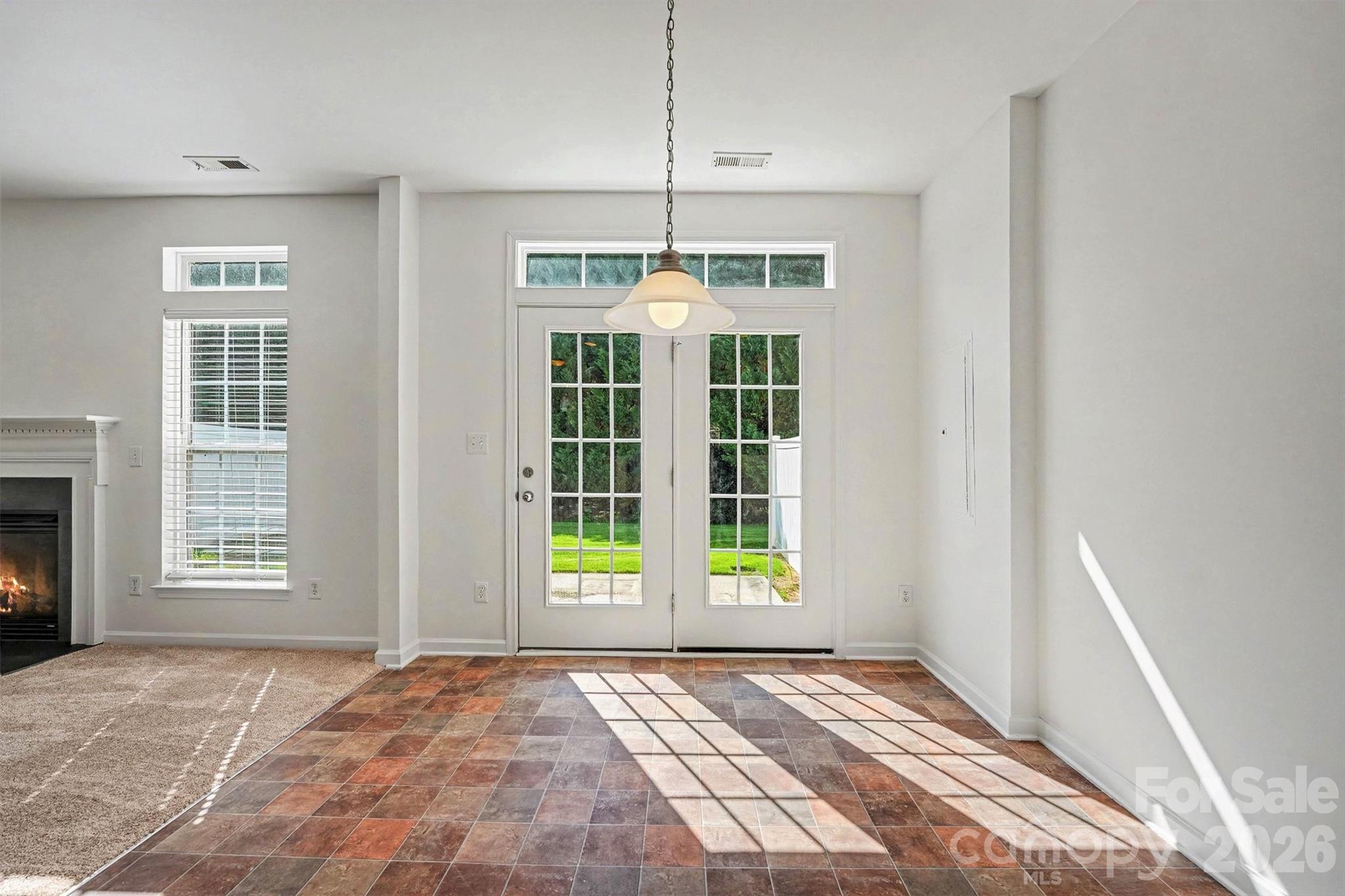 Light pours in thru the French doors into the breakfast area - 107 S Arcadian Way, Mooresville