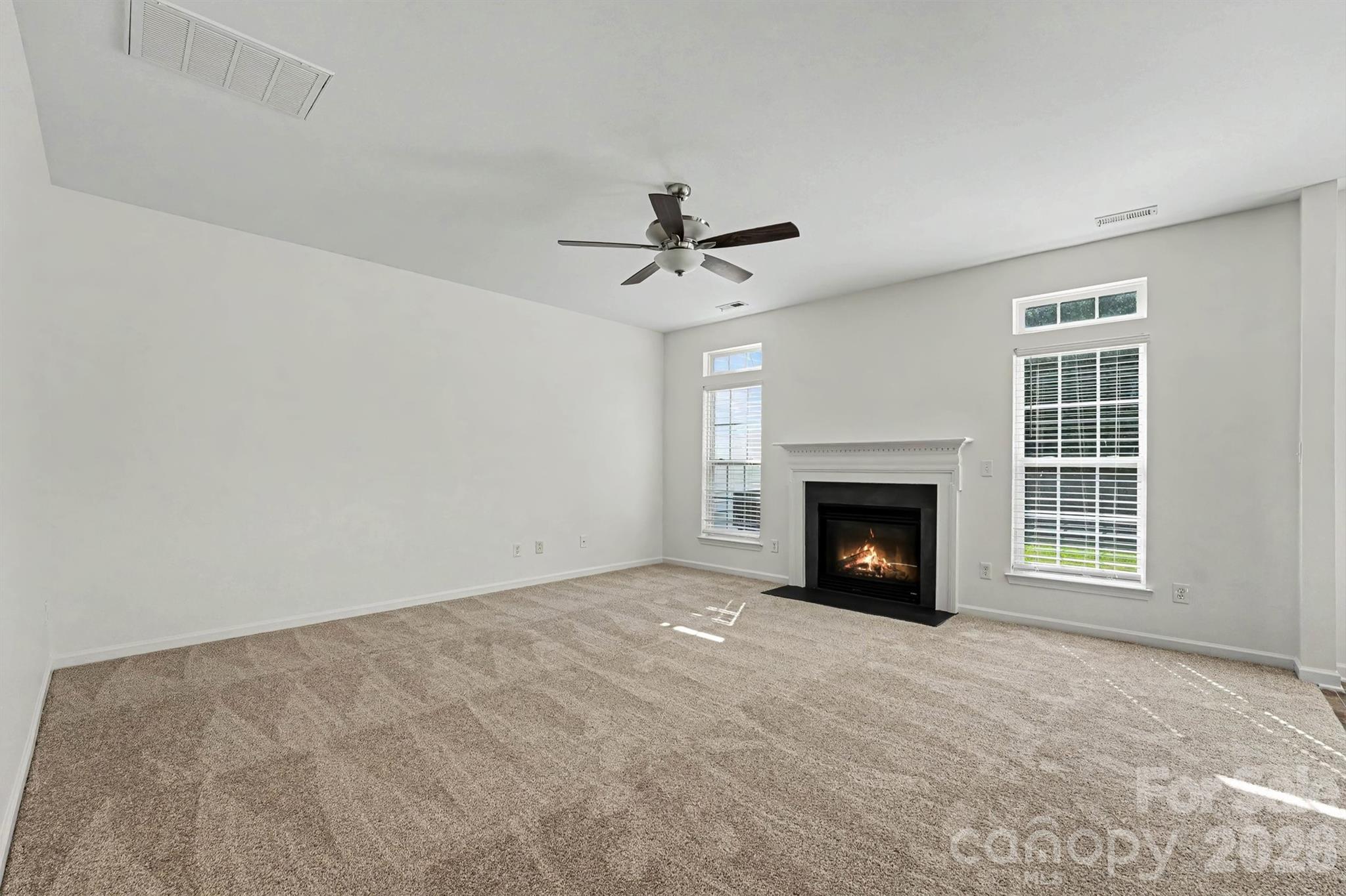 Living room opens to kitchen & breakfast area - 107 S Arcadian Way, Mooresville